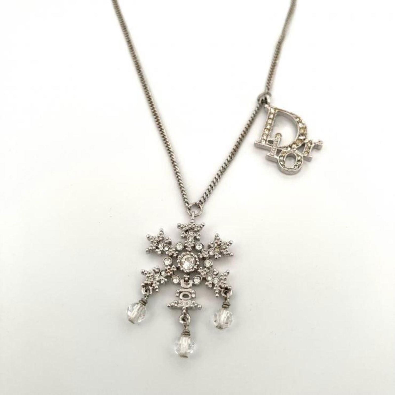 Necklace Christian Dior Snowflake Logo Rhinestone Silver GP: Necklace Christian Dior Snowflake Logo Rhinestone Silver GP This listing features Necklace Christian Dior Snowflake Logo Rhinestone Silver GP. Item specifics are provided below. Item Specifics: Brand: