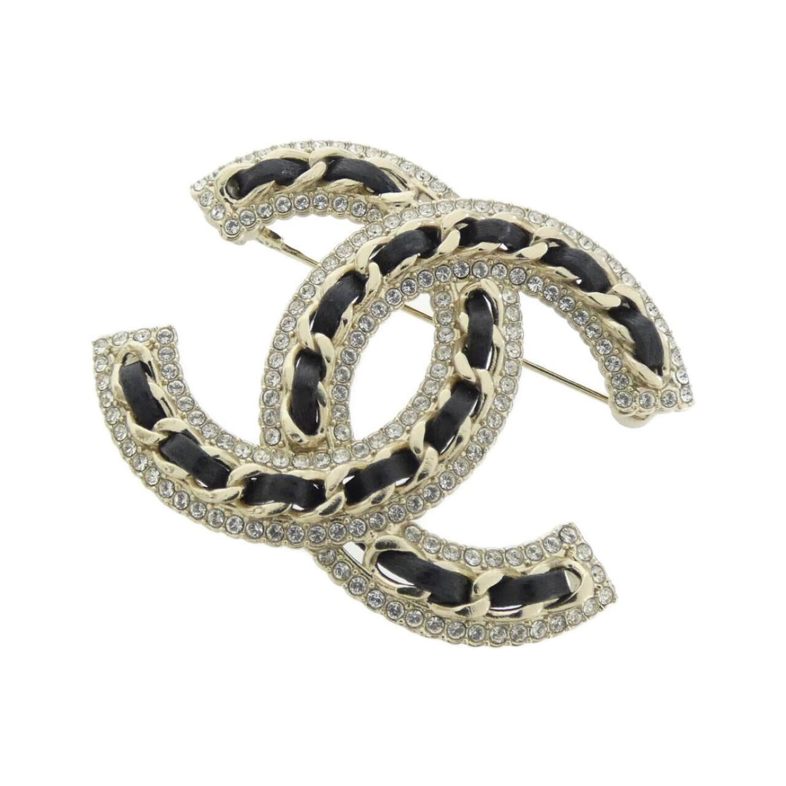 Leather Chanel Brooch: Leather Chanel Brooch This listing features Leather Chanel Brooch. Item specifics are provided below. Item Specifics: Brand: Chanel Type: Brooch Gender: Women Material: Leather Color: Black, Gold Ston