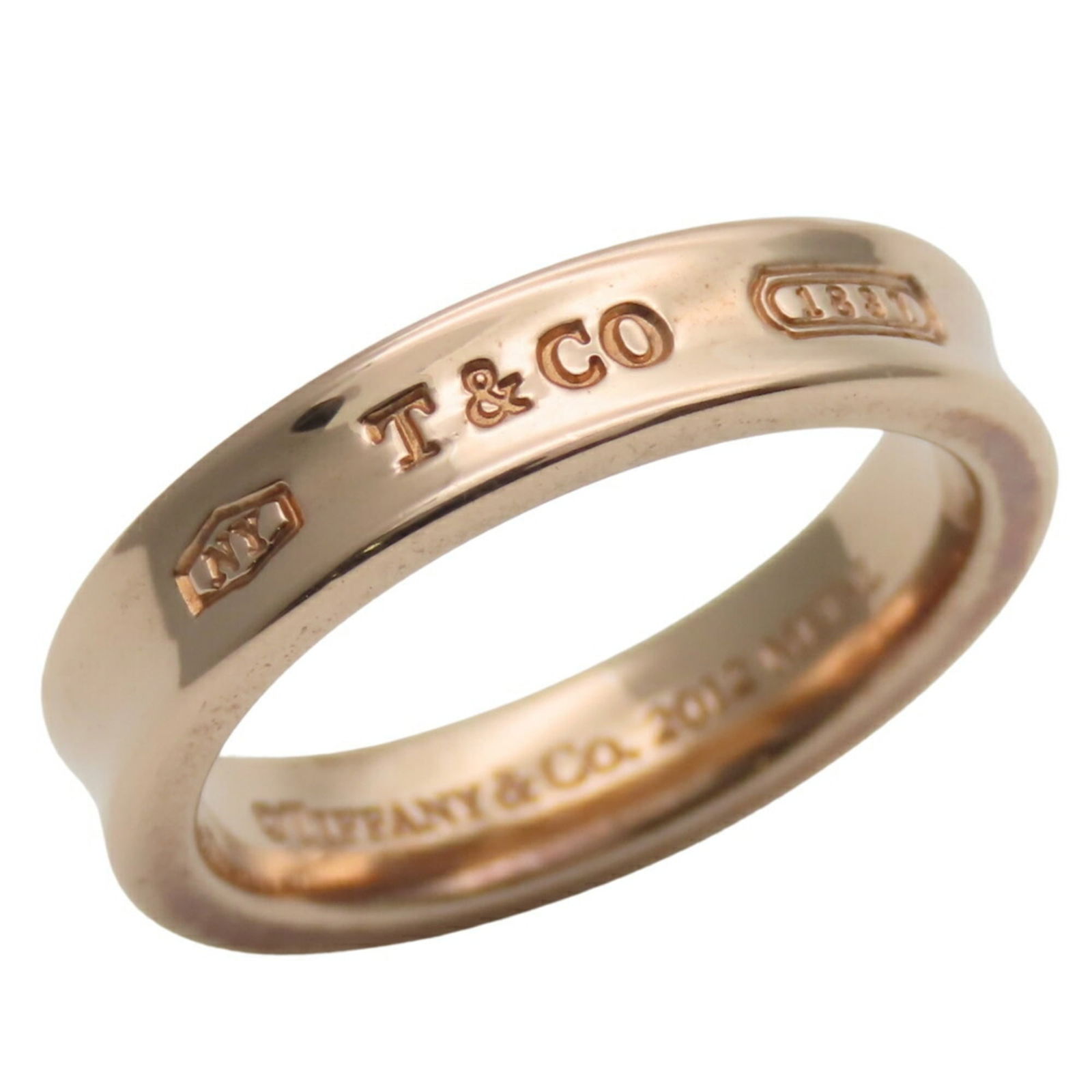Metal Tiffany Band Ring: Metal Tiffany Band Ring This listing features Metal Tiffany Band Ring. Item specifics are provided below. Item Specifics: Brand: Tiffany Type: Band Ring Gender: Women Color: Pink Gold Material: