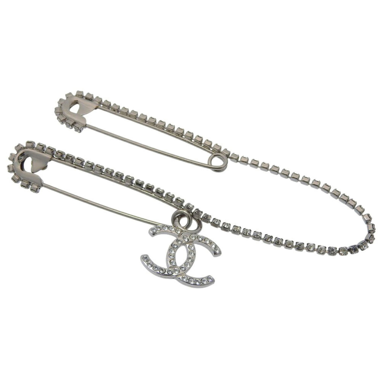 Metal Chanel Pin Brooch: Metal Chanel Pin Brooch This listing features Metal Chanel Pin Brooch. Item specifics are provided below. Item Specifics: Brand: Chanel Type: Pin Brooch Gender: Women Material: Metal Color: Silver Sto