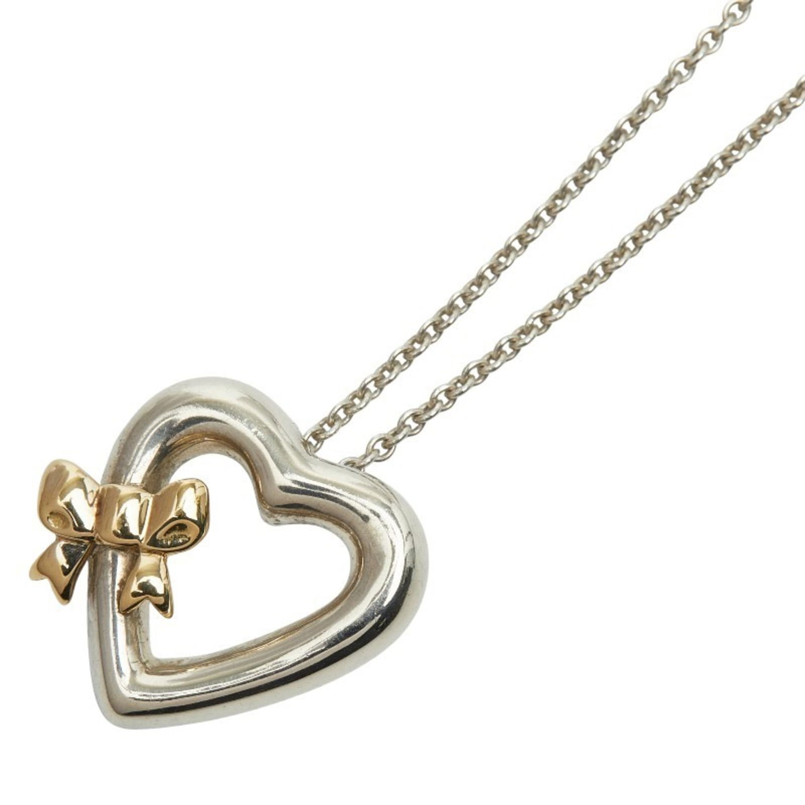 TIFFANY & Co. Vintage Heart Ribbon Pendant Necklace in 925 Sterling Silver and 18K Yellow Gold: TIFFANY & Co. Vintage Heart Ribbon Pendant Necklace in 925 Sterling Silver and 18K Yellow Gold (stamped 750). Women's. This listing features TIFFANY & Co. Vintage Heart Ribbon Pendant Necklace in 925