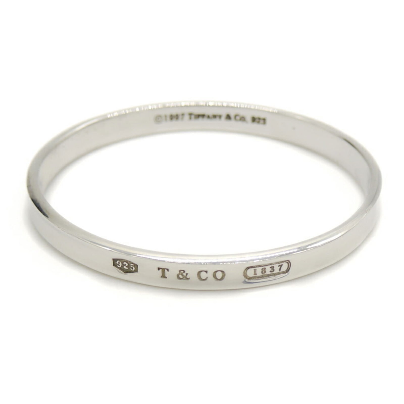 925 Tiffany Bangle Silver: 925 Tiffany Bangle Silver This listing features 925 Tiffany Bangle Silver. Item specifics are provided below. Item Specifics: Brand: Tiffany Type: Bangle Gender: Women Material: Silver 925 Color: Silv