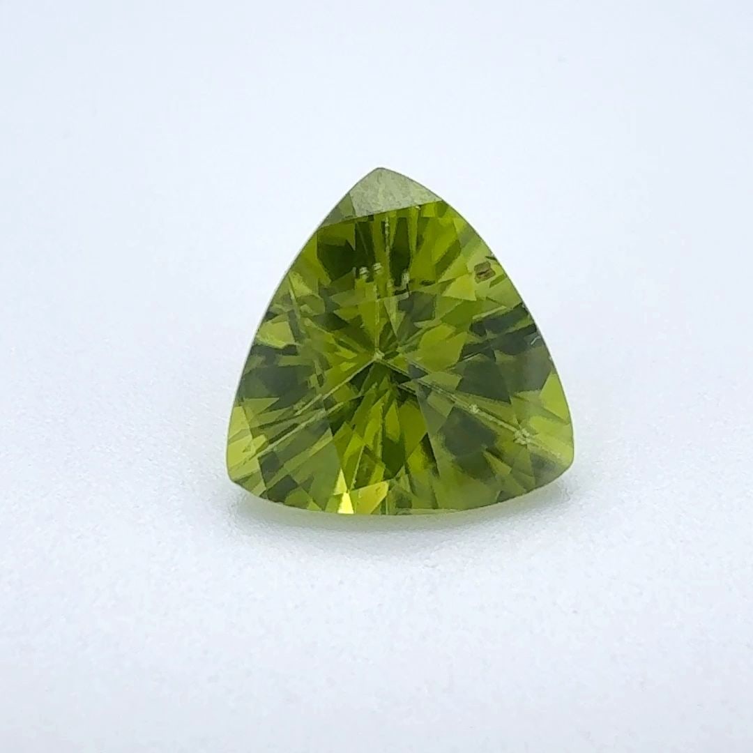 Loose Peridot Gemstone - Trilliant 2.62ct Green EC: Loose Peridot Gemstone - Trilliant 2.62ct Green EC This listing features Loose Peridot Gemstone - Trilliant 2.62ct Green EC. Item specifics are provided below. Item Specifics: Type: Peridot Carat: