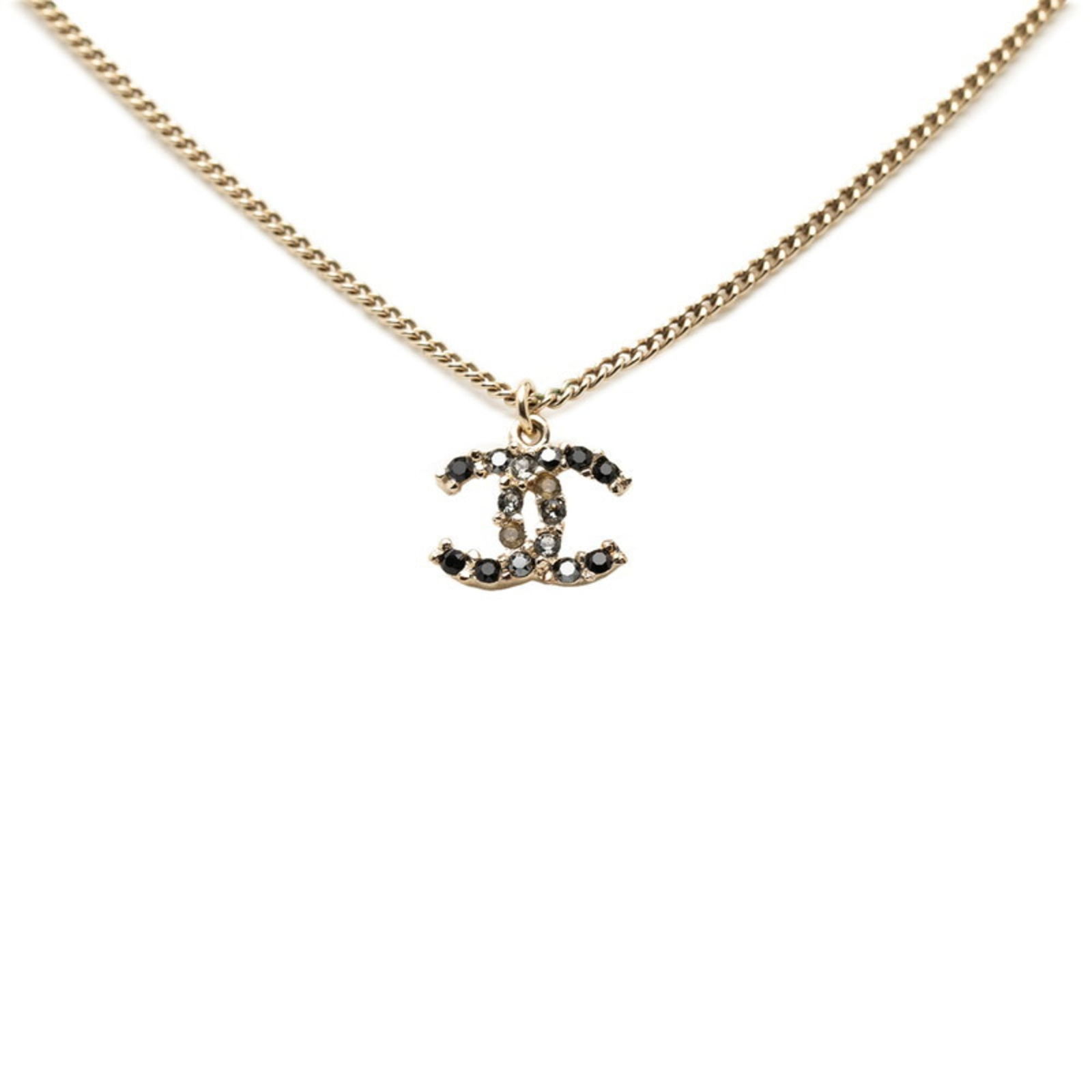 Women Chanel Coco Mark Rhinestone Necklace in Gold with Black Plated Faux Pearls for: Women Chanel Coco Mark Rhinestone Necklace in Gold with Black Plated Faux Pearls for This listing features Women Chanel Coco Mark Rhinestone Necklace in Gold with Black Plated Faux Pearls for. Item sp