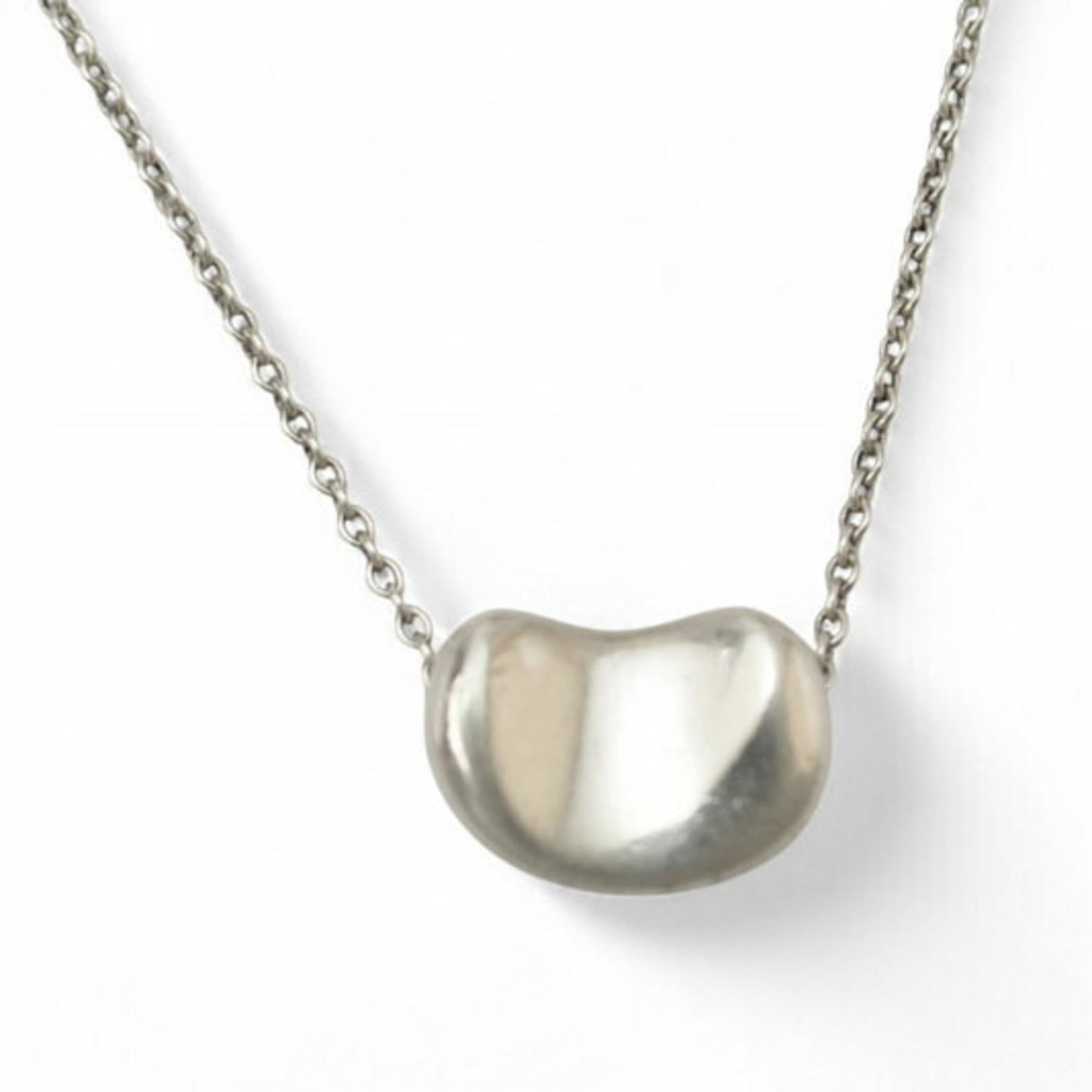 0.9cm Wide - Tiffany & Co. Elsa Peretti Bean Motif Pendant in Silver: 0.9cm Wide - Tiffany & Co. Elsa Peretti Bean Motif Pendant in Silver This listing features 0.9cm Wide - Tiffany & Co. Elsa Peretti Bean Motif Pendant in Silver. Item specifics are provided below. Item