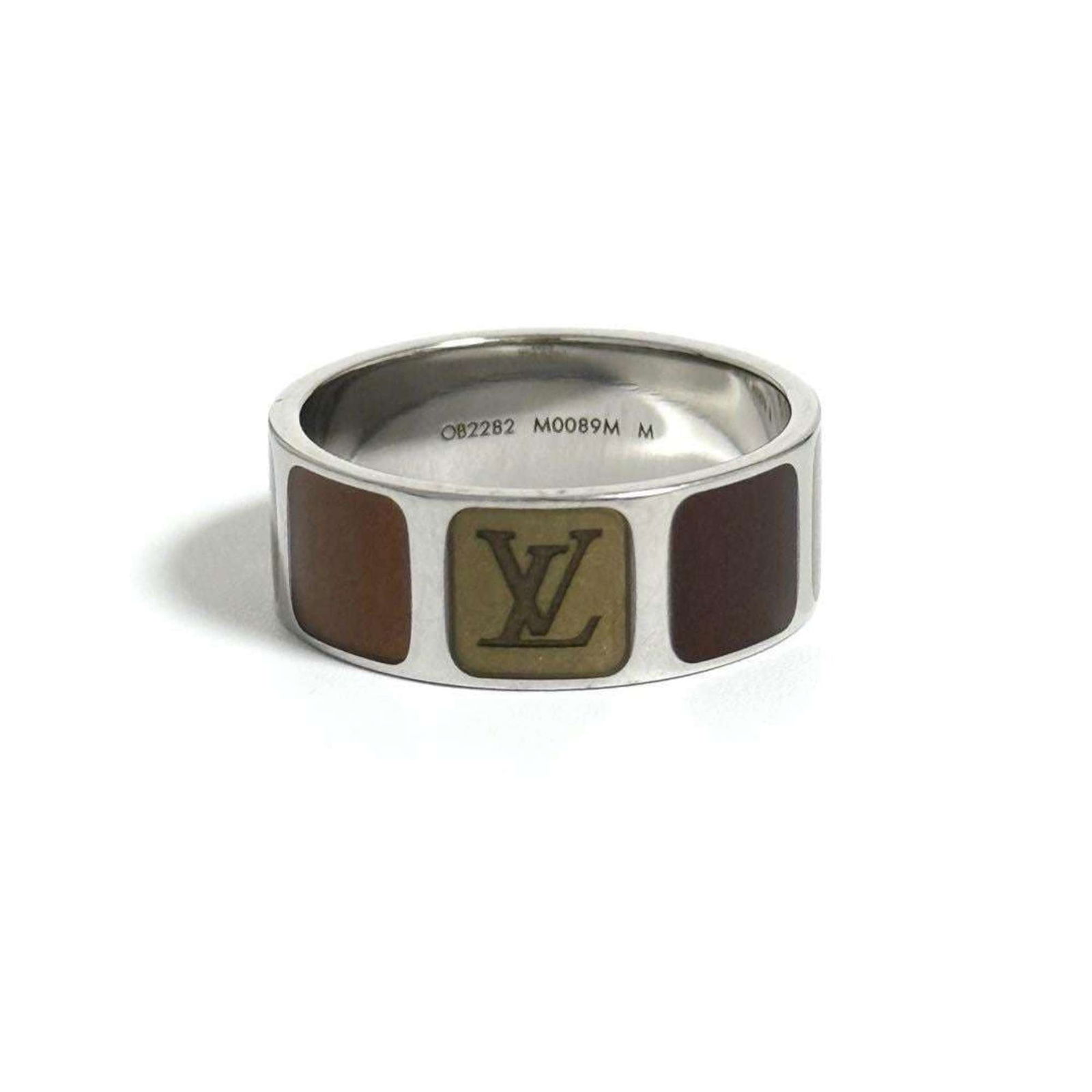 Metal Louis Vuitton Band Ring: Metal Louis Vuitton Band Ring This listing features Metal Louis Vuitton Band Ring. Item specifics are provided below. Item Specifics: Brand: Louis Vuitton Type: Band Ring Gender: Men Color: Brown