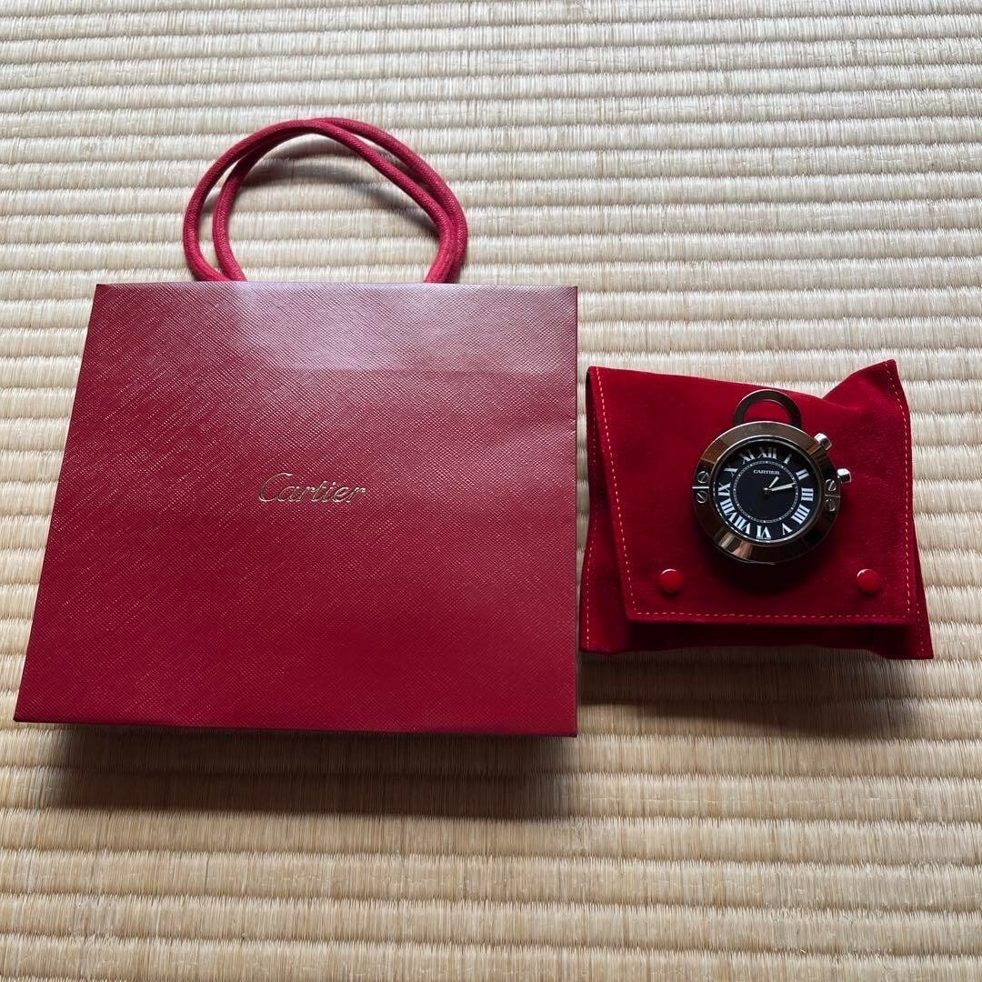 Collectible Cartier Rare Travel Clock Round Santos de Cartier With Pouch Luxury: Collectible Cartier Rare Travel Clock Round Santos de Cartier With Pouch Luxury This listing features Collectible Cartier Rare Travel Clock Round Santos de Cartier With Pouch Luxury. Item specifics ar