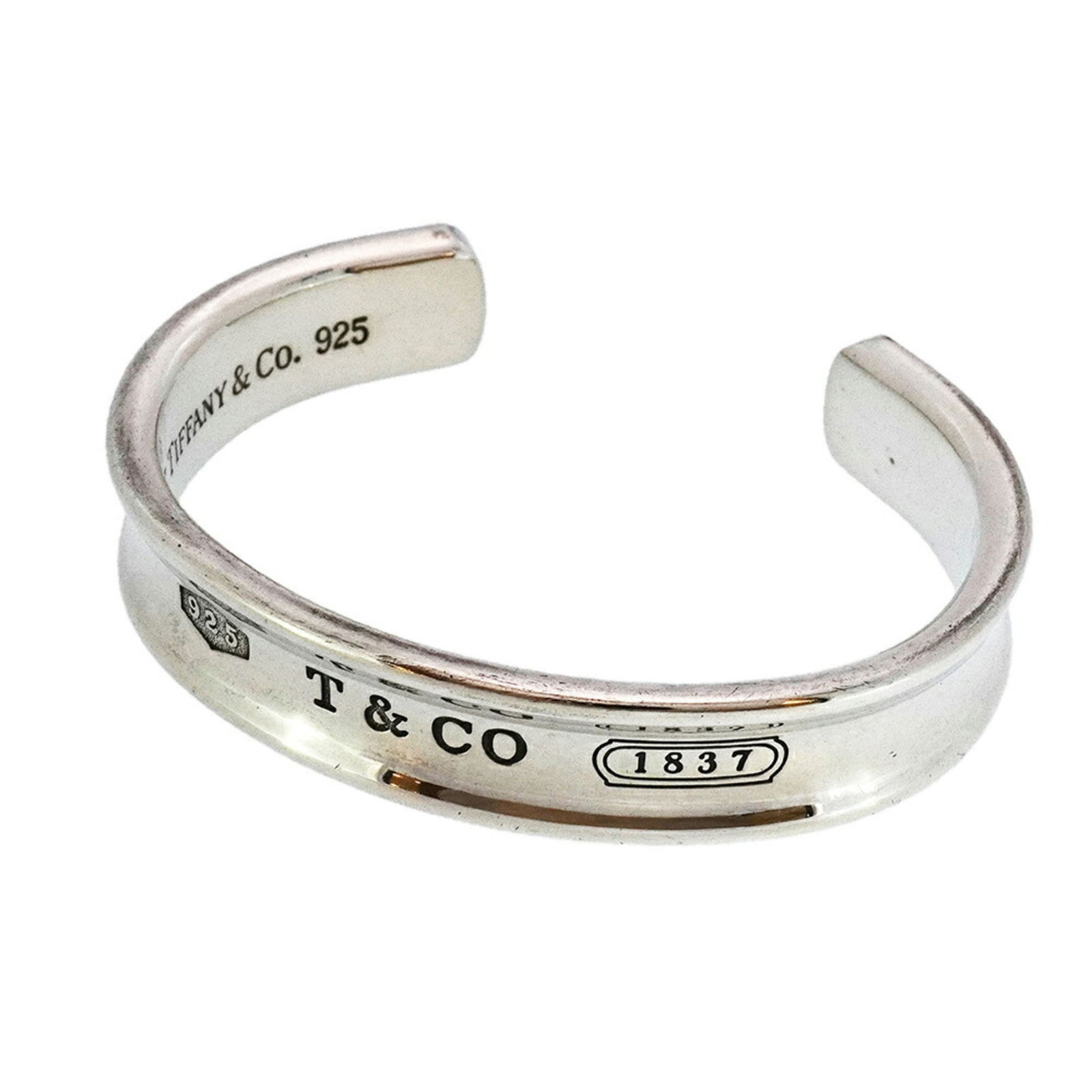 925 Tiffany Bangle Silver: 925 Tiffany Bangle Silver This listing features 925 Tiffany Bangle Silver. Item specifics are provided below. Item Specifics: Brand: Tiffany Type: Bangle Gender: Women Material: Silver 925 Length: 14.