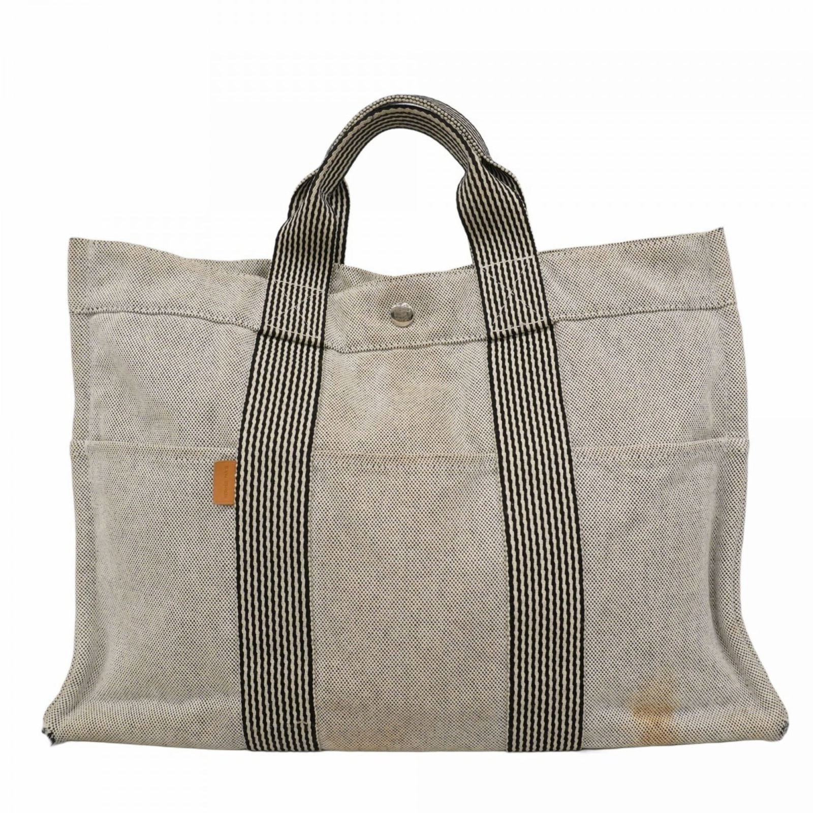 Canvas Hermes Tote Bag: Canvas Hermes Tote Bag This listing features Canvas Hermes Tote Bag. Item specifics are provided below. Item Specifics: Brand: Hermes Type: Tote Bag Material: Canvas Color: Gray Hardware Color: