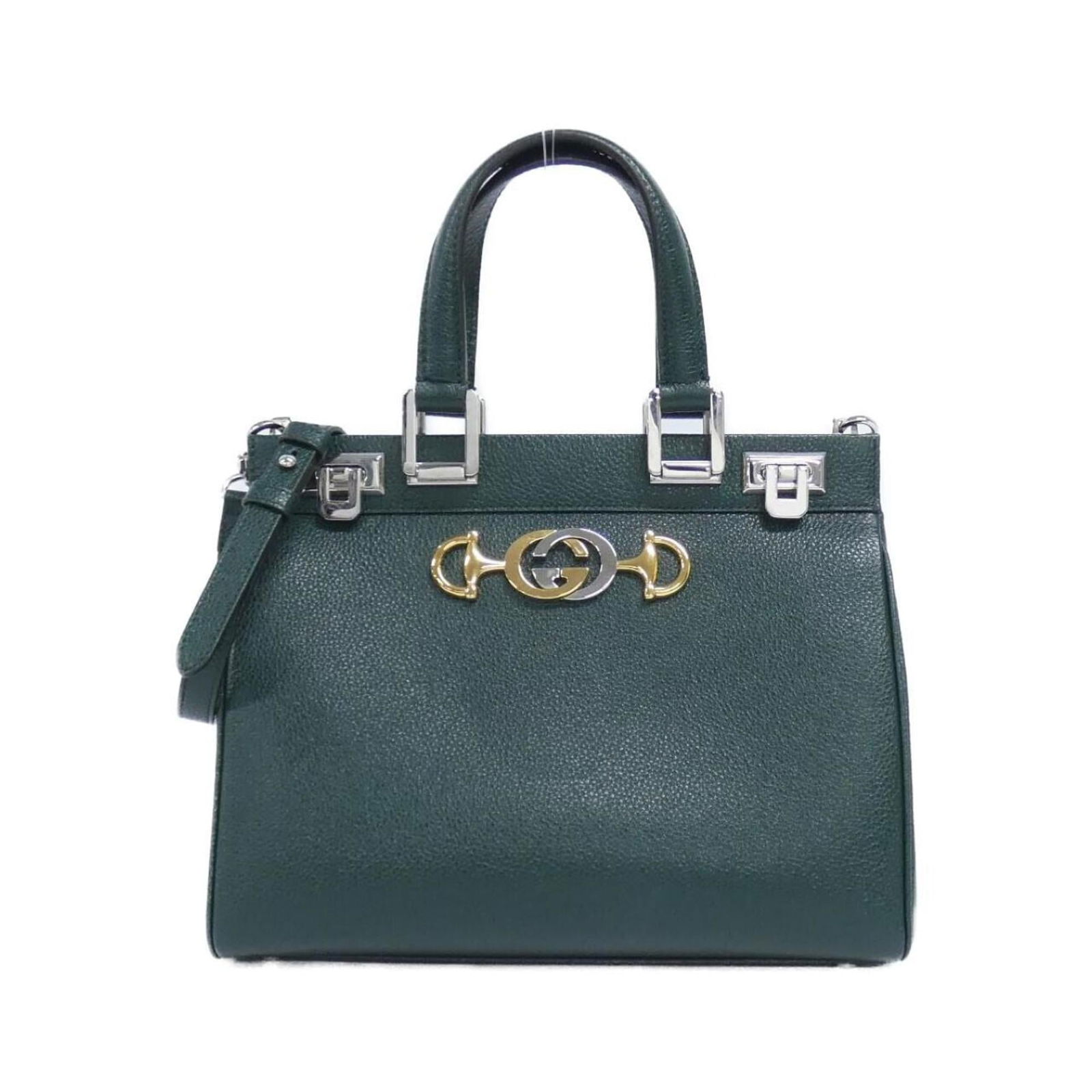 Leather Gucci Handbag: Leather Gucci Handbag This listing features Leather Gucci Handbag. Item specifics are provided below. Item Specifics: Brand: Gucci Type: Handbag Material: Leather Color: Dark Green Gender: Women Size