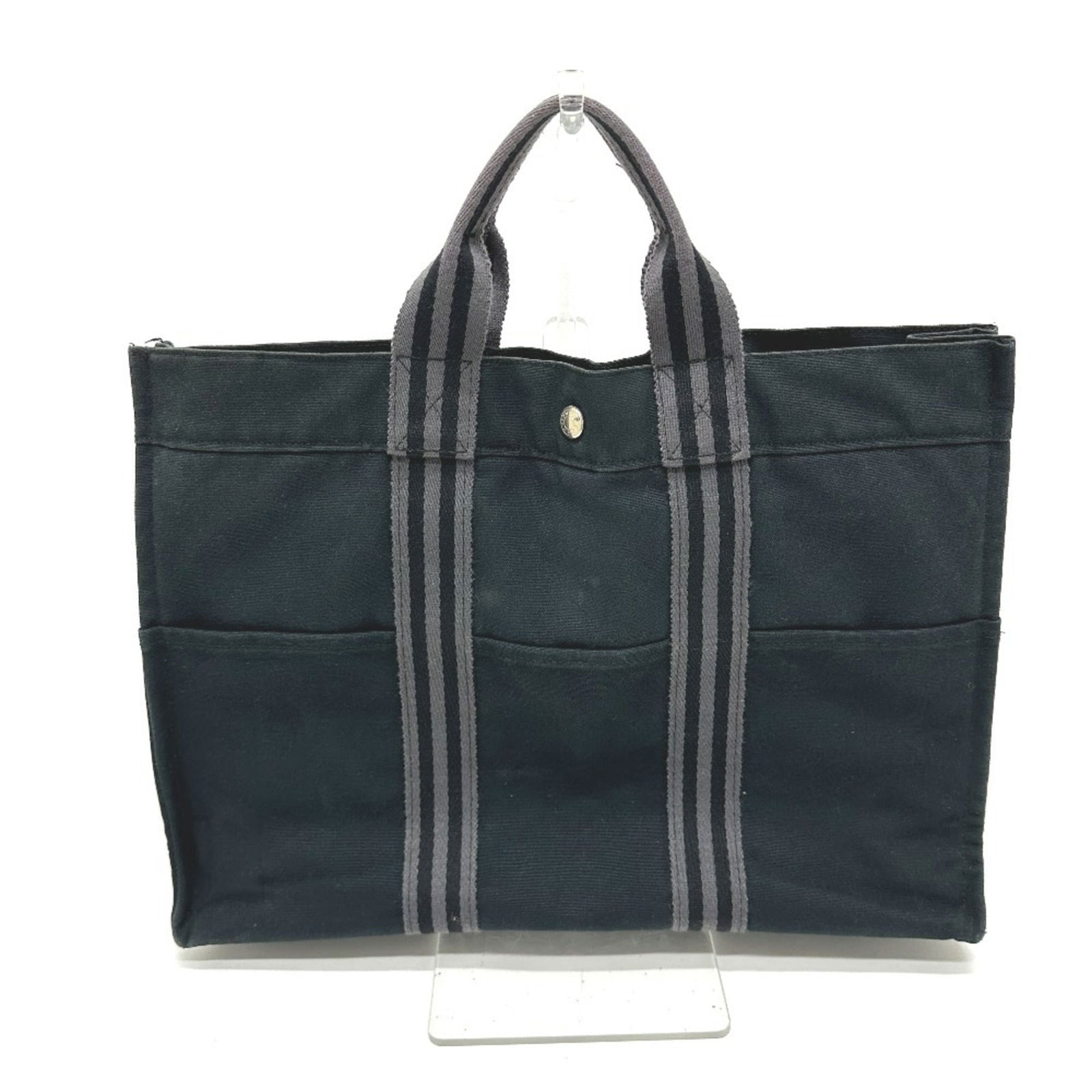 Canvas Hermes Tote Bag: Canvas Hermes Tote Bag This listing features Canvas Hermes Tote Bag. Item specifics are provided below. Item Specifics: Brand: Hermes Type: Tote Bag Material: Canvas Color: Black Closure: Snap Fastene