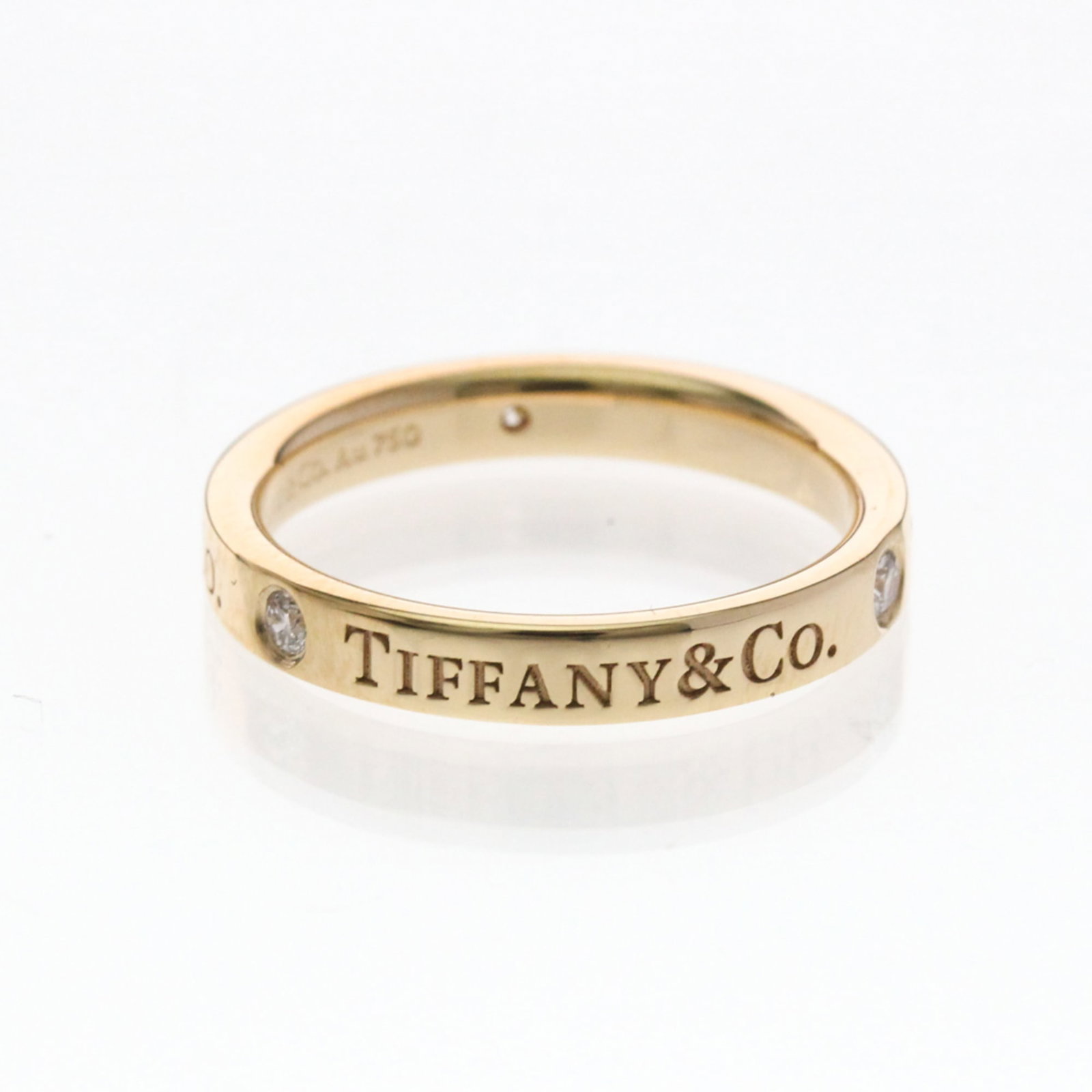 (18K) Tiffany Band Ring Pink Gold: (18K) Tiffany Band Ring Pink Gold This listing features (18K) Tiffany Band Ring Pink Gold. Item specifics are provided below. Item Specifics: Brand: Tiffany Type: Band Ring Style: Fashion Gender: Wome