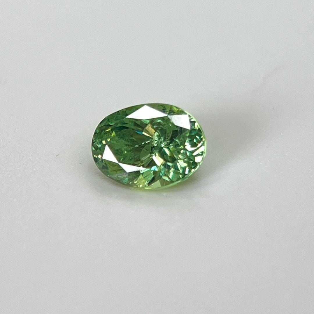 Loose Garnet Gemstone - Oval 1.37ct Green SI: Loose Garnet Gemstone - Oval 1.37ct Green SI This listing features Loose Garnet Gemstone - Oval 1.37ct Green SI. Item specifics are provided below. Item Specifics: Type: Garnet Carat: 1.37 Cut: