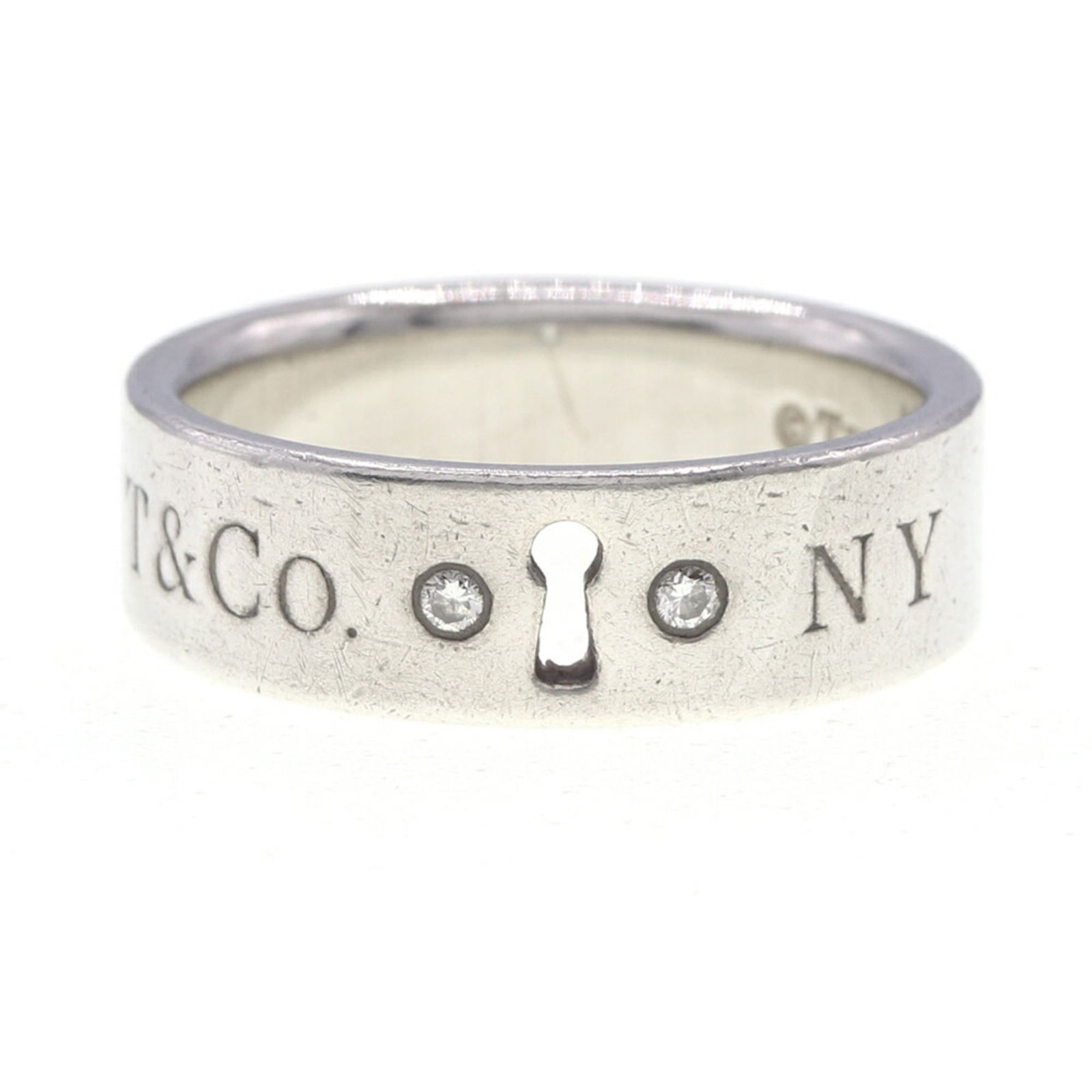 JP 11 - Tiffany & Co. Women's Lock Keyhole Ring with 2 Diamonds - Sterling Silver 925 - US Size: JP 11 - Tiffany & Co. Women's Lock Keyhole Ring with 2 Diamonds - Sterling Silver 925 - US Size 5.5-5 3/ 4 This listing features JP 11 - Tiffany & Co. Women's Lock Keyhole Ring with 2 Diamonds - Sterl