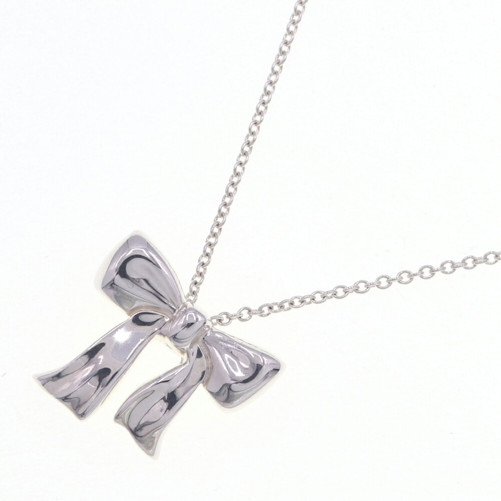 CO. Tiffany & Co. necklace ribbon pendant sterling silver 925 choker for women. TIFFANY: CO. Tiffany & Co. necklace ribbon pendant sterling silver 925 choker for women. TIFFANY This listing features CO. Tiffany & Co. necklace ribbon pendant sterling silver 925 choker for women. TIFFANY. I