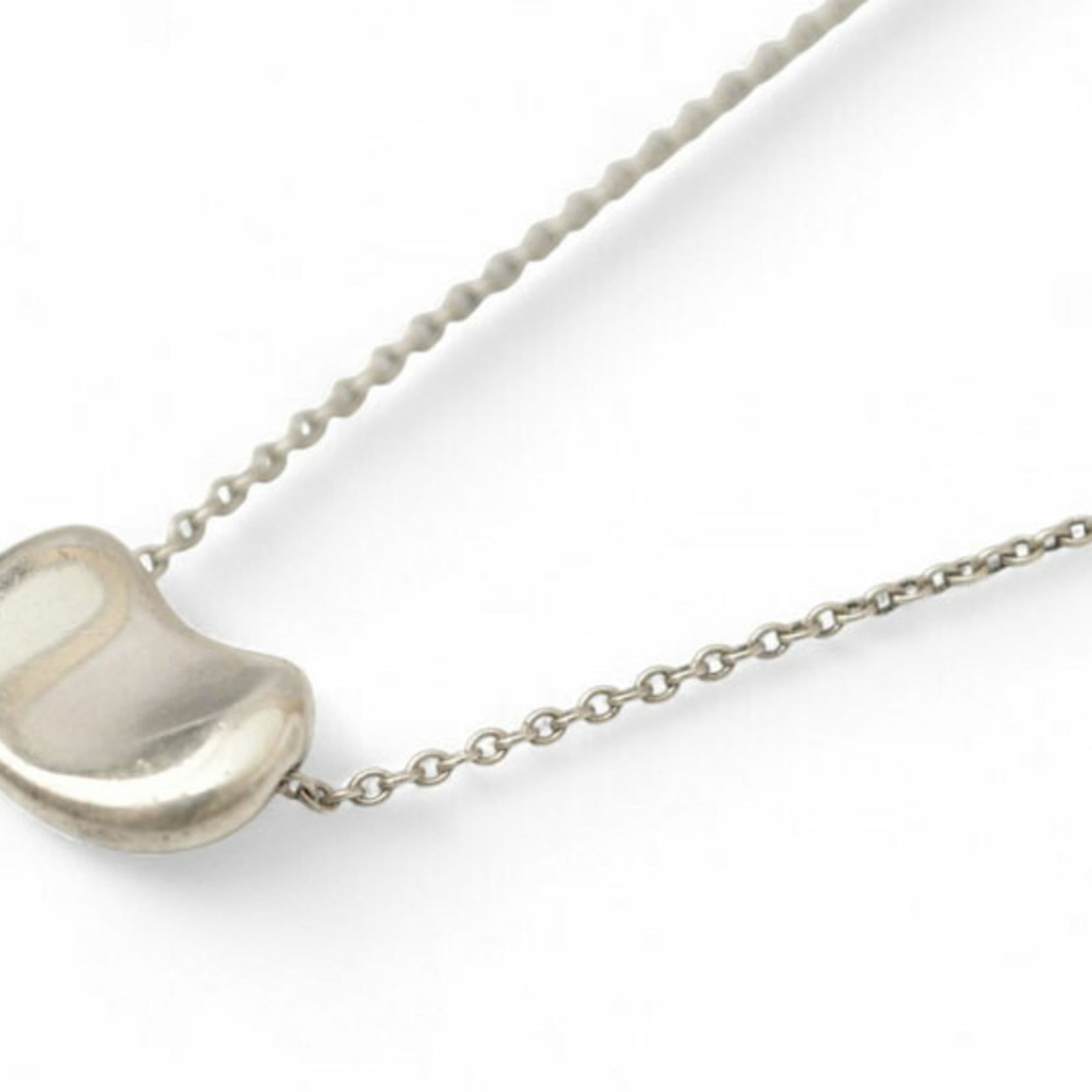 1.2cm Wide - Tiffany & Co. Elsa Peretti Bean Motif Pendant in Silver: 1.2cm Wide - Tiffany & Co. Elsa Peretti Bean Motif Pendant in Silver This listing features 1.2cm Wide - Tiffany & Co. Elsa Peretti Bean Motif Pendant in Silver. Item specifics are provided below. 