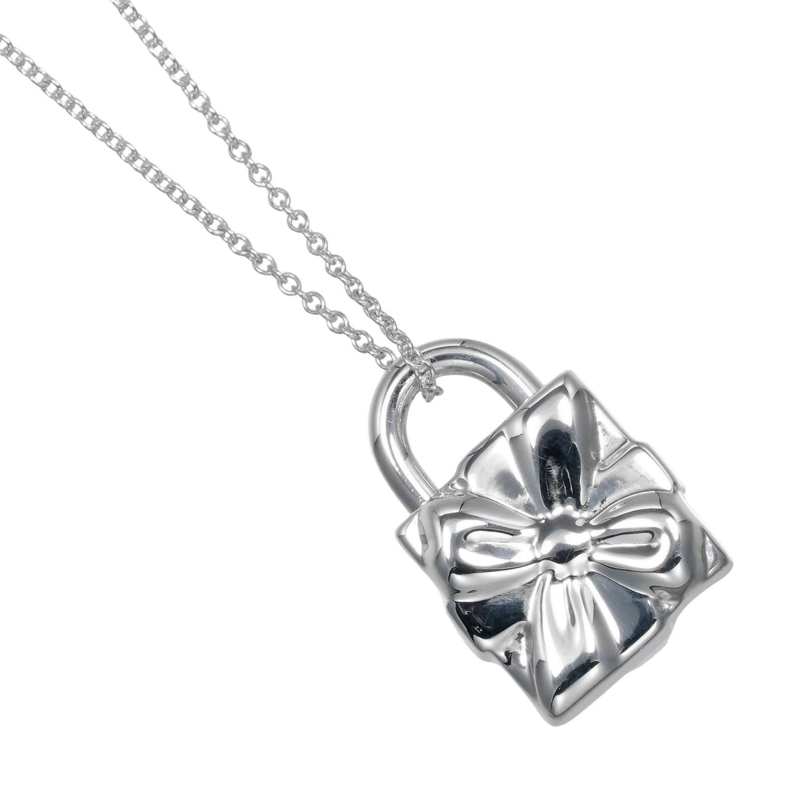 approx. 15.6g - Tiffany & Co. Ribbon Box Lock Necklace - 925 Silver: approx. 15.6g - Tiffany & Co. Ribbon Box Lock Necklace - 925 Silver This listing features approx. 15.6g - Tiffany & Co. Ribbon Box Lock Necklace - 925 Silver. Item specifics are provided below. Item