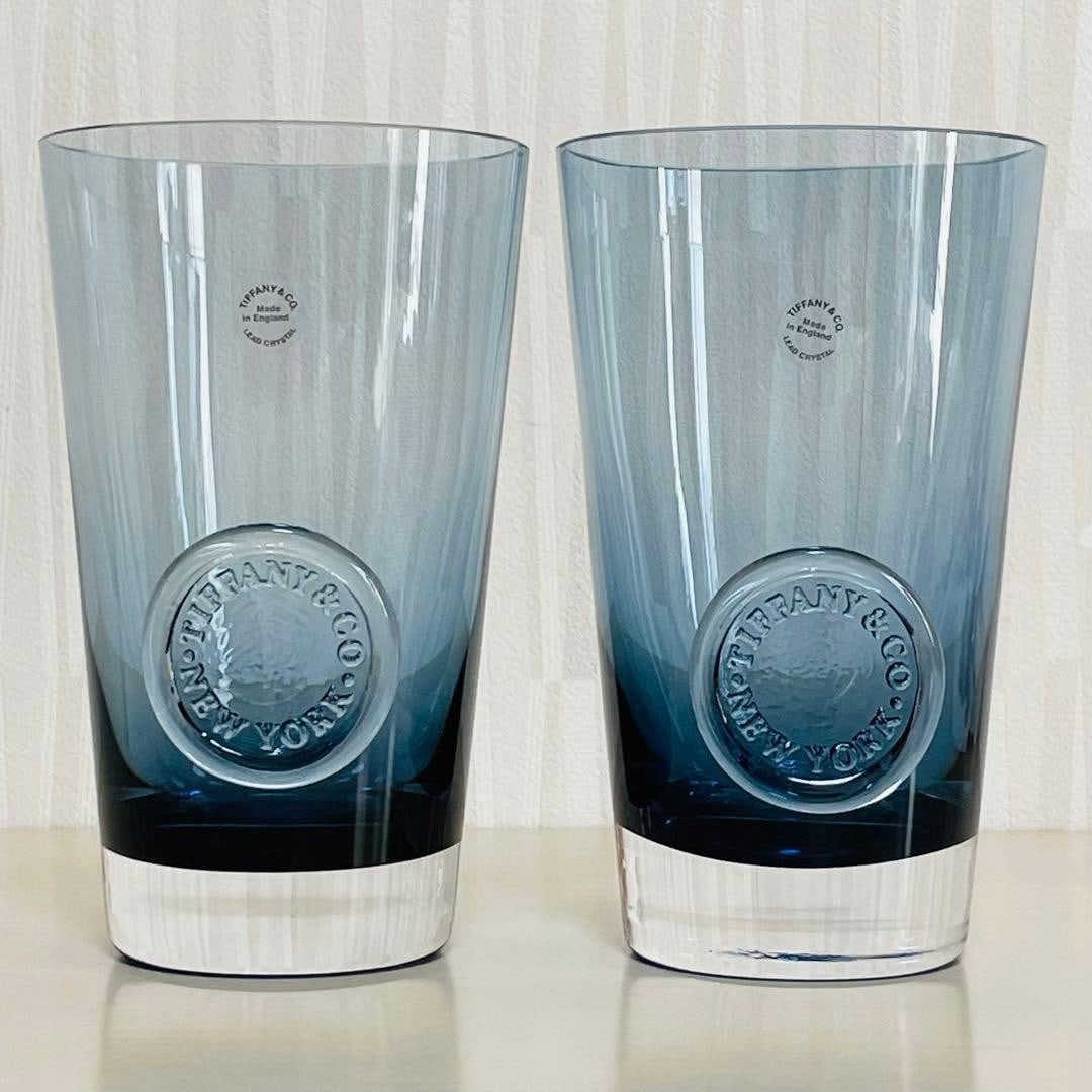 Drinkware TIFFANY & CO. Ink Blue Seal LEAD Crystal Water Glass Pair Set Of 2: Drinkware TIFFANY & CO. Ink Blue Seal LEAD Crystal Water Glass Pair Set Of 2 This listing features Drinkware TIFFANY & CO. Ink Blue Seal LEAD Crystal Water Glass Pair Set Of 2. Item specifics are prov