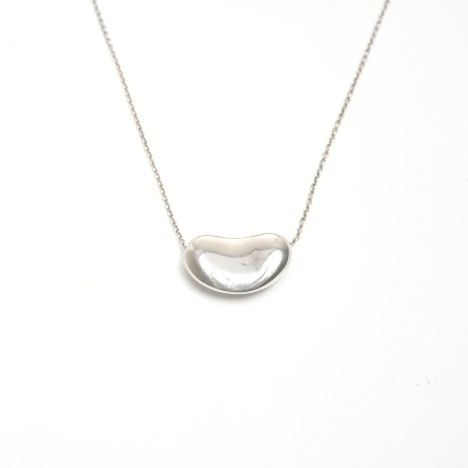 WS24560 - Tiffany & Co. 925 Bean Necklace in Silver: WS24560 - Tiffany & Co. 925 Bean Necklace in Silver This listing features WS24560 - Tiffany & Co. 925 Bean Necklace in Silver. Item specifics are provided below. Item Specifics: Brand: Tiffany