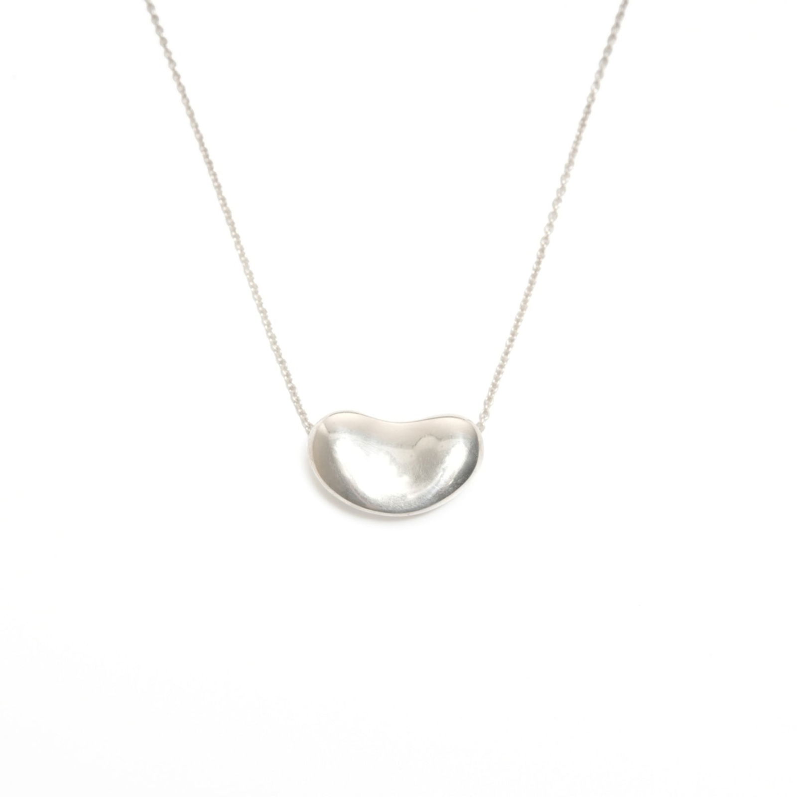 WS24562 - Tiffany & Co. 925 Bean Necklace in Silver: WS24562 - Tiffany & Co. 925 Bean Necklace in Silver This listing features WS24562 - Tiffany & Co. 925 Bean Necklace in Silver. Item specifics are provided below. Item Specifics: Brand: Tiffany