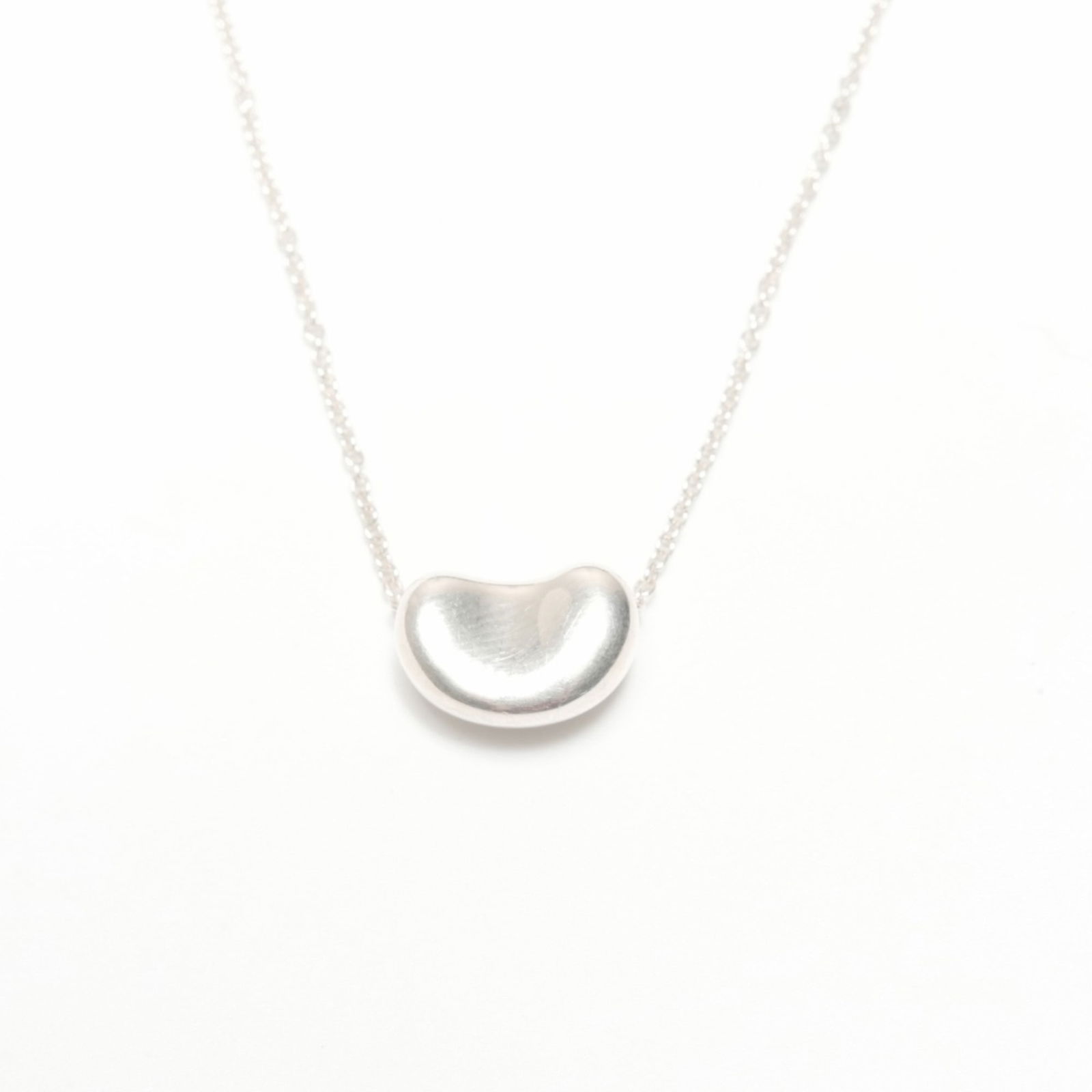 WS24334 Tiffany & Co. Beans 925 Sterling Silver Necklace: WS24334 Tiffany & Co. Beans 925 Sterling Silver Necklace This listing features WS24334 Tiffany & Co. Beans 925 Sterling Silver Necklace. Item specifics are provided below. Item Specifics: Brand: