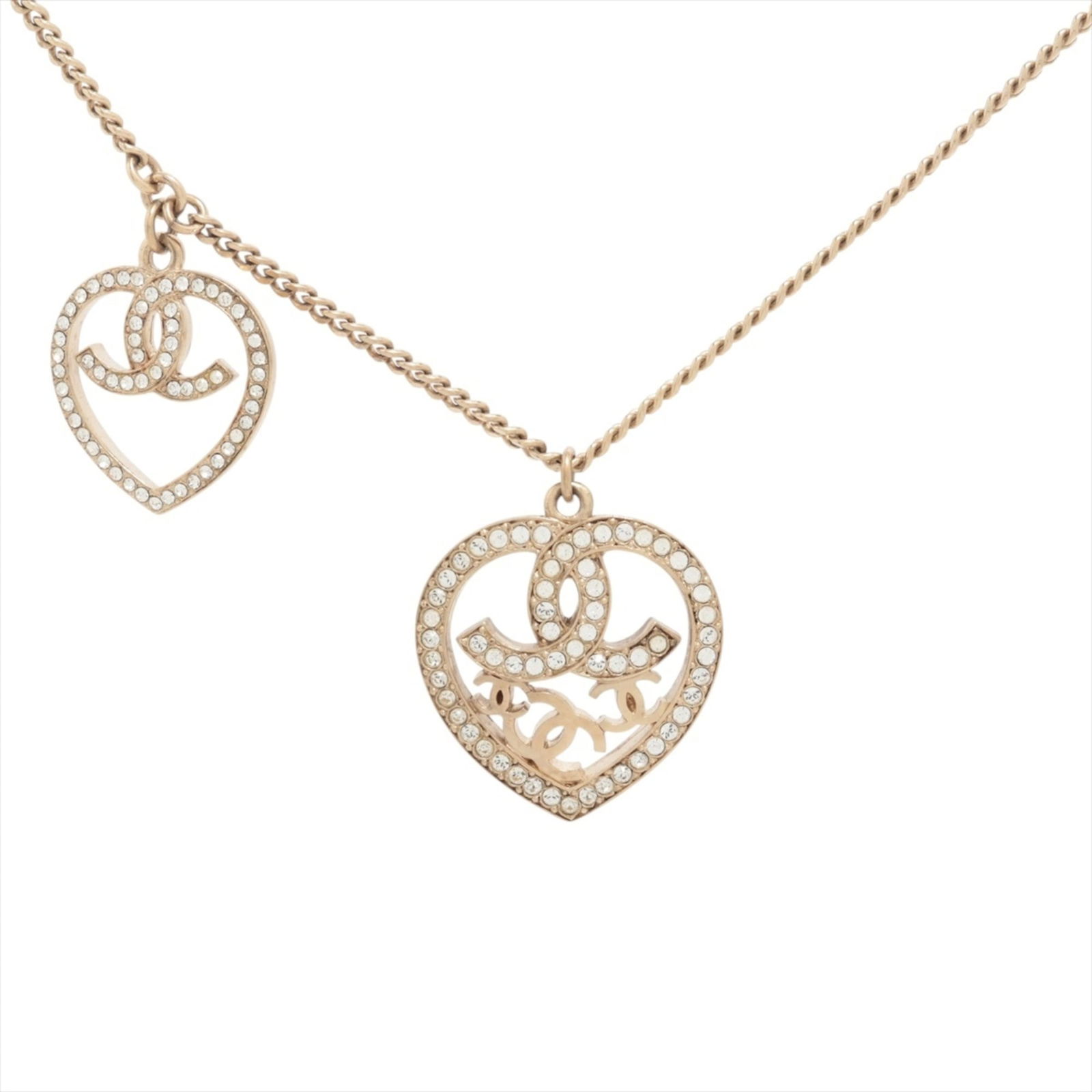 Gold CHANEL 09C 2009 Coco Mark Heart Rhinestone Necklace in Champagne: Gold CHANEL 09C 2009 Coco Mark Heart Rhinestone Necklace in Champagne This listing features Gold CHANEL 09C 2009 Coco Mark Heart Rhinestone Necklace in Champagne. Item specifics are provided below. 