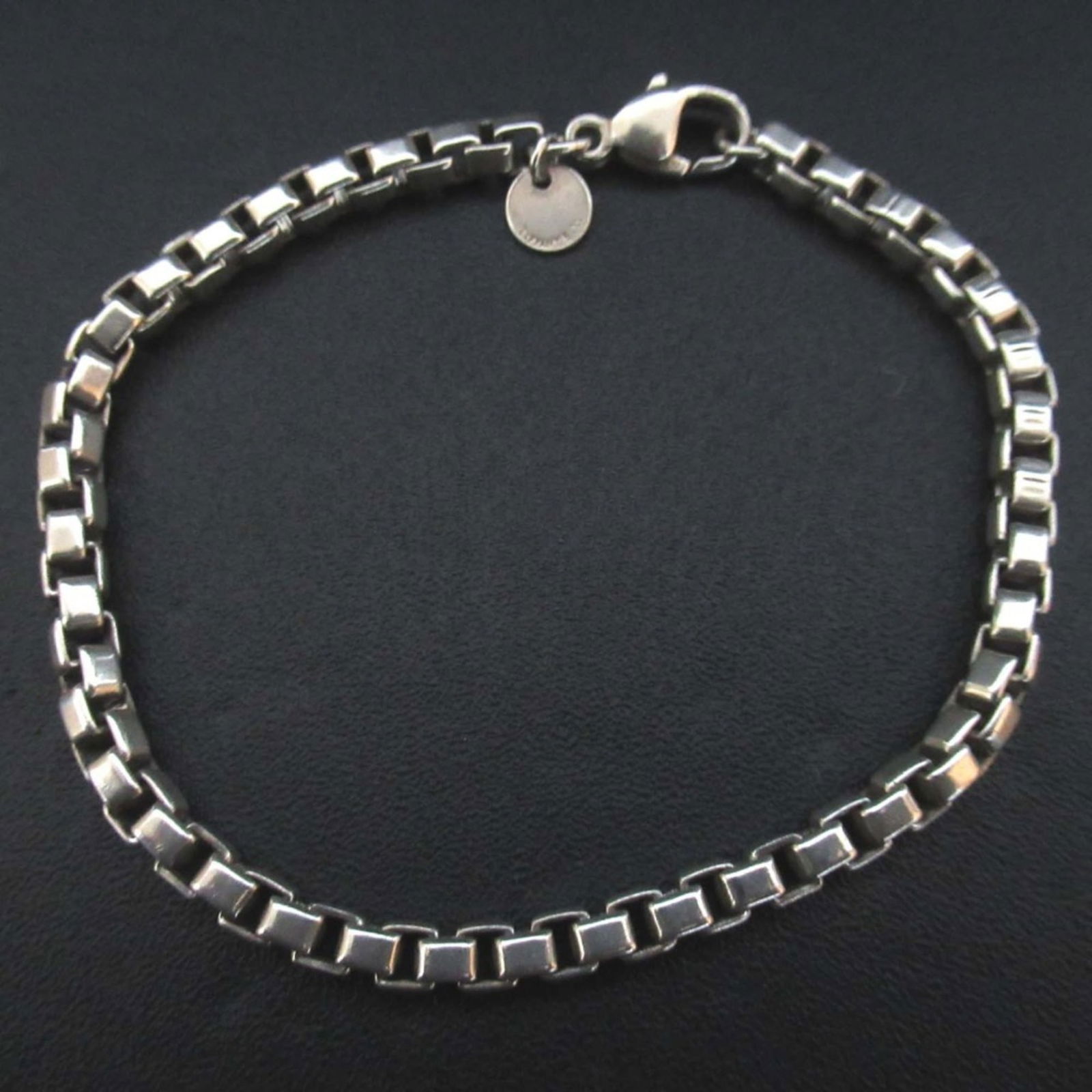 925 Tiffany Charm Bracelet Silver: 925 Tiffany Charm Bracelet Silver This listing features 925 Tiffany Charm Bracelet Silver. Item specifics are provided below. Item Specifics: Brand: Tiffany Type: Charm Bracelet Gender: Men