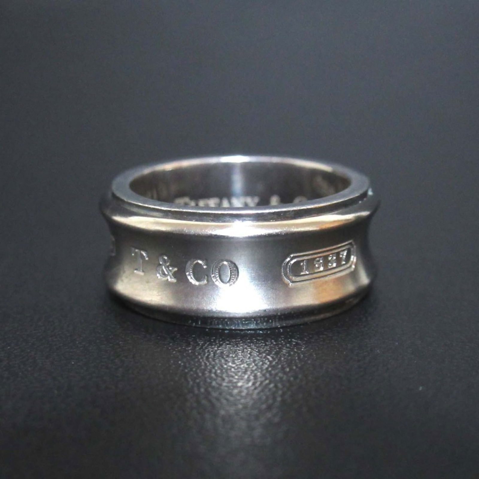 Titanium - Tiffany Band Ring Silver 925: Titanium - Tiffany Band Ring Silver 925 This listing features Titanium - Tiffany Band Ring Silver 925. Item specifics are provided below. Item Specifics: Brand: Tiffany Type: Band Ring Gender: Women C