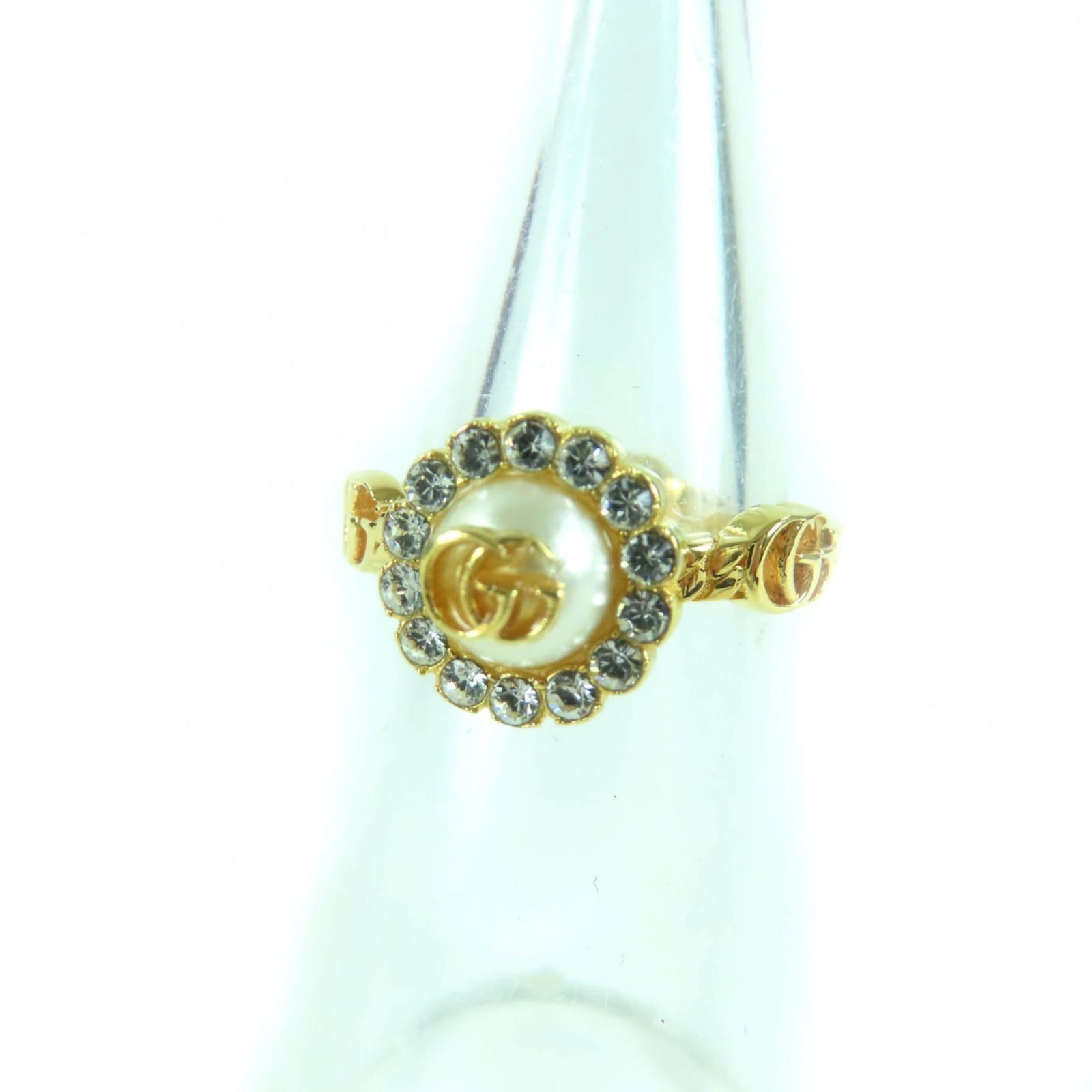Ring Gucci Band: Ring Gucci Band This listing features Ring Gucci Band. Item specifics are provided below. Item Specifics: Brand: Gucci Type: Band Ring Gender: Women Color: Gold Stone: Artificial Pearl, Rhinestone Bra