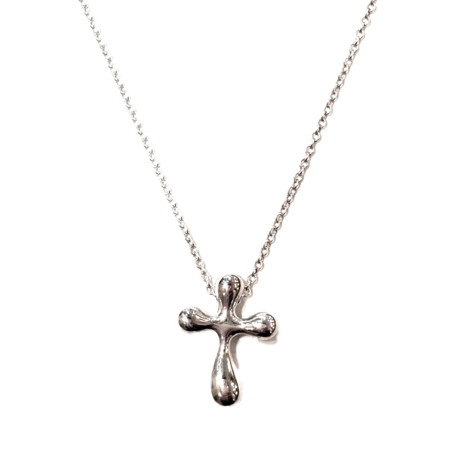 CO. Tiffany & Co. Elsa Peretti cross necklace pendant in silver (Ag925). TIFFANY: CO. Tiffany & Co. Elsa Peretti cross necklace pendant in silver (Ag925). TIFFANY This listing features CO. Tiffany & Co. Elsa Peretti cross necklace pendant in silver (Ag925). TIFFANY. Item specifics
