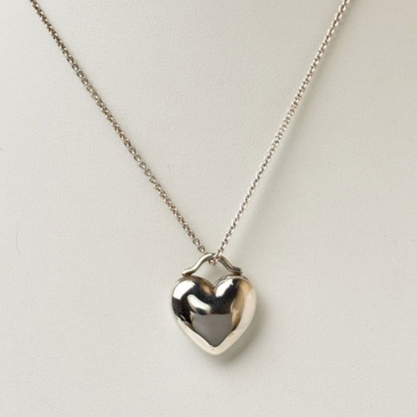 1.9cm Wide - Tiffany & Co. Sentimental Pendant in Silver with Heart Motif: 1.9cm Wide - Tiffany & Co. Sentimental Pendant in Silver with Heart Motif This listing features 1.9cm Wide - Tiffany & Co. Sentimental Pendant in Silver with Heart Motif. Item specifics are provided