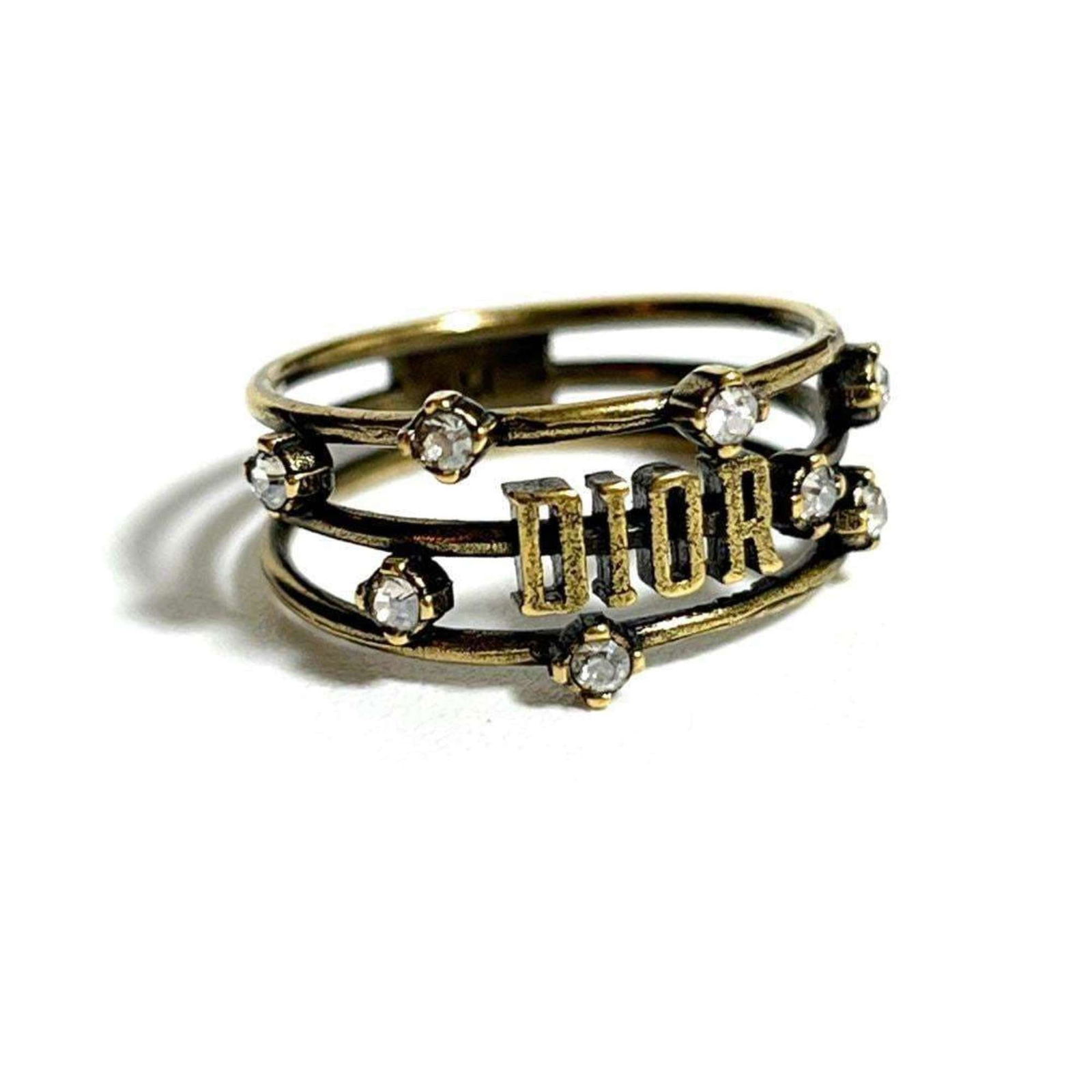 Rhinestone - Christian Dior Band Ring Metal: Rhinestone - Christian Dior Band Ring Metal This listing features Rhinestone - Christian Dior Band Ring Metal. Item specifics are provided below. Item Specifics: Brand: Christian Dior Type: Band
