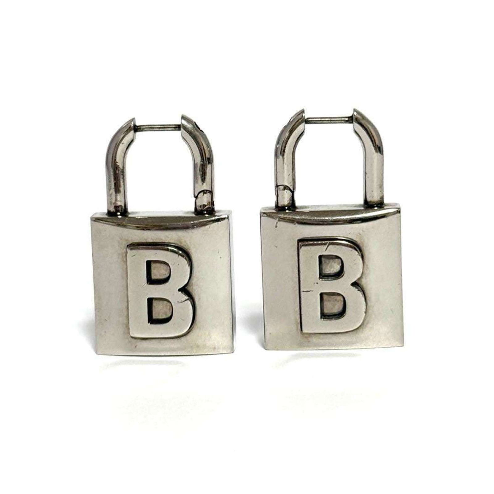 Metal Balenciaga Stud Earrings: Metal Balenciaga Stud Earrings This listing features Metal Balenciaga Stud Earrings. Item specifics are provided below. Item Specifics: Brand: Balenciaga Type: Stud Earrings Gender: Men,Women
