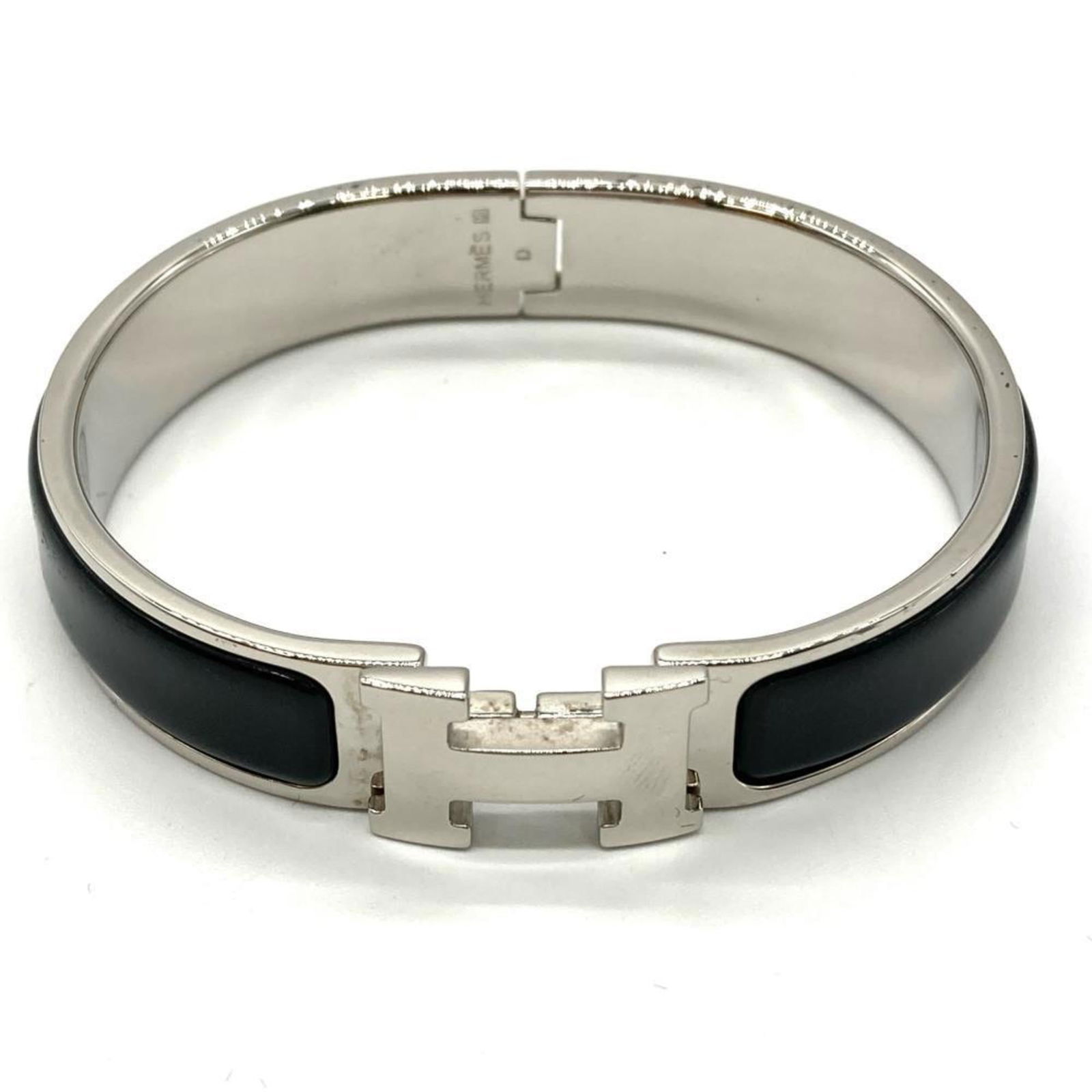 Enamel Hermes Bangle: Enamel Hermes Bangle This listing features Enamel Hermes Bangle. Item specifics are provided below. Item Specifics: Brand: Hermes Type: Bangle Gender: Women Material: Enamel Color: Black, Silver Lengt