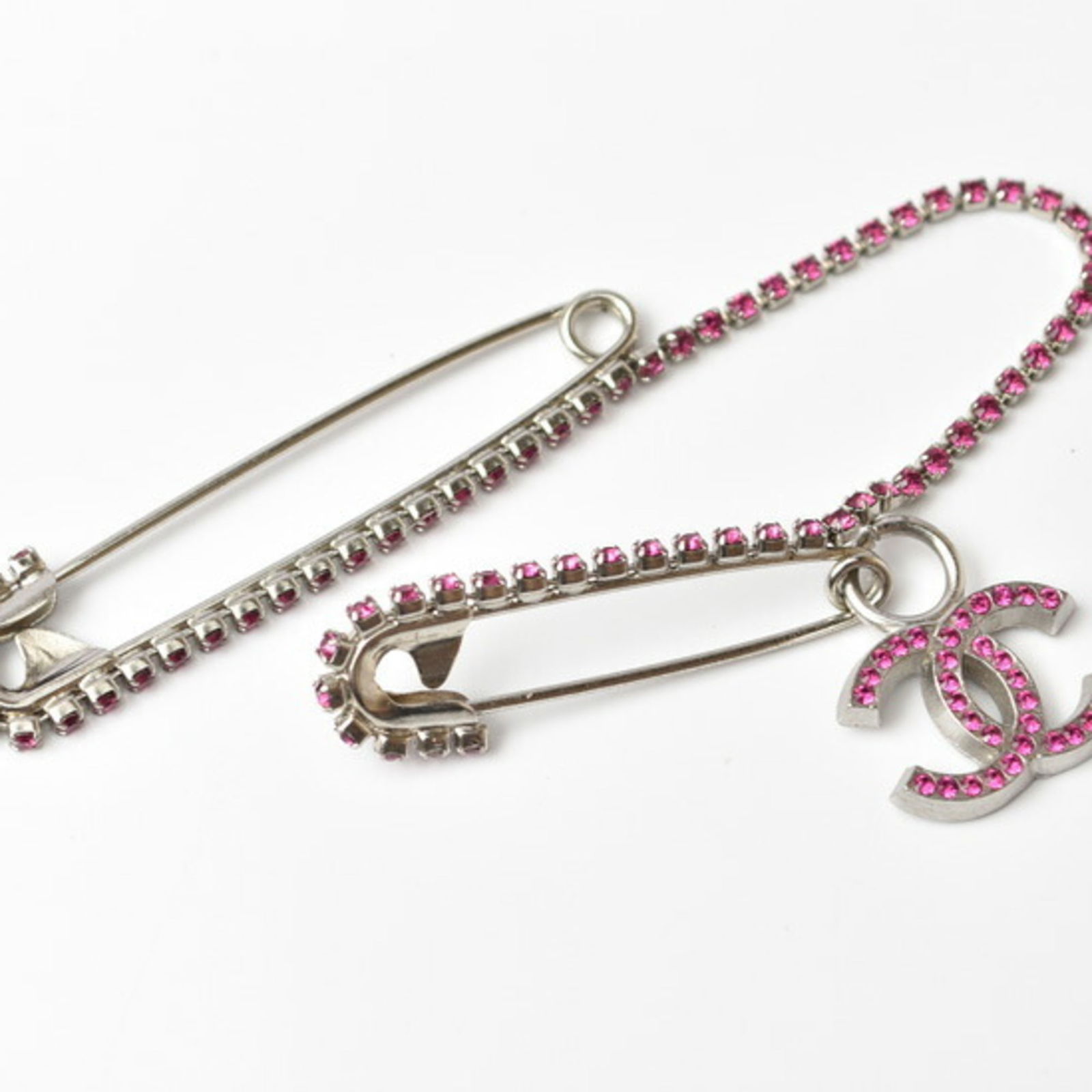 Brass Chanel Pin Brooch: Brass Chanel Pin Brooch This listing features Brass Chanel Pin Brooch. Item specifics are provided below. Item Specifics: Brand: Chanel Type: Pin Brooch Gender: Women Material: Brass Color: Silver Sto