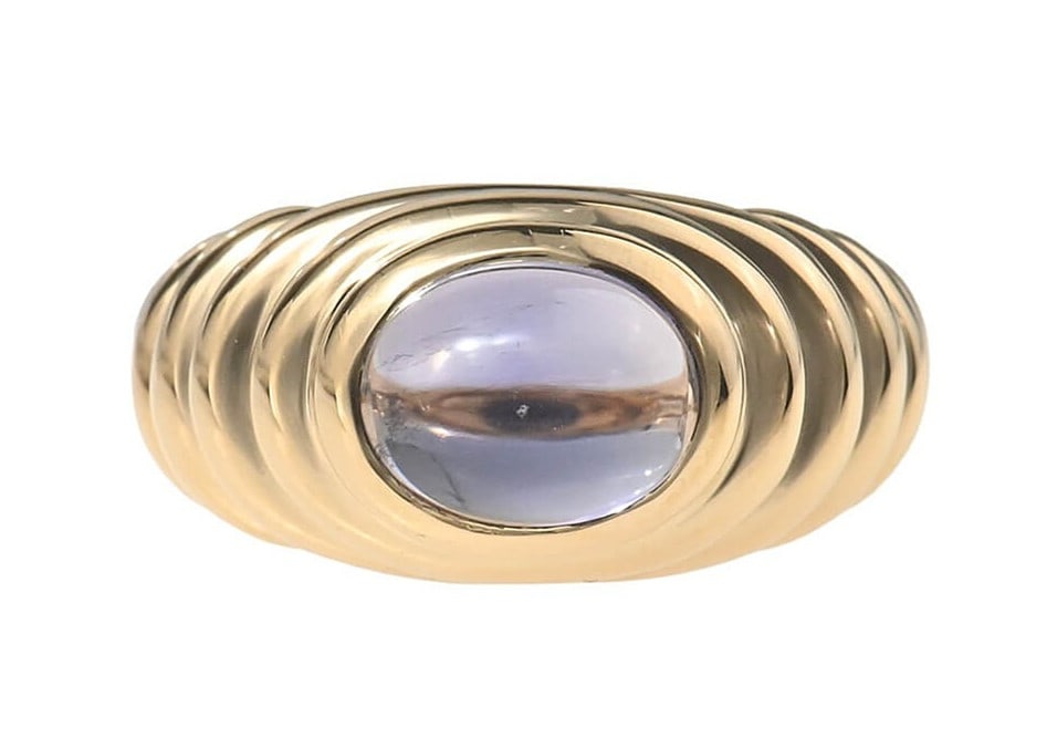 EU50 Bvlgari Vintage Baccellato Cabochon Iolite 18k Yellow Gold Dome Ring US5.5: EU50 Bvlgari Vintage Baccellato Cabochon Iolite 18k Yellow Gold Dome Ring US5.5 A stunning vintage Bvlgari ring, circa [approximate era], boasts a majestic 18k yellow gold dome setting adorned with a
