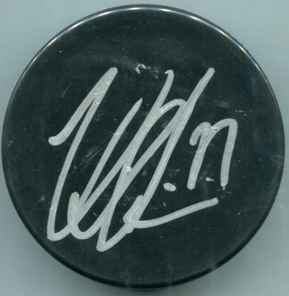 (JSA) Victor Hedman Autographed Hockey Puck: (JSA) Victor Hedman Autographed Hockey Puck Get ready to add some Tampa Bay Lightning flair to your hockey collection! This autographed puck, signed by Victor Hedman in silver sharpie, is a unique