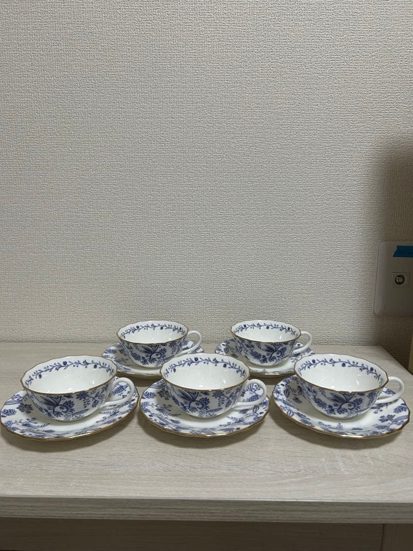 Noritake Blue Sorentino Bone China White Cup and Saucer Set of 5: Noritake Blue Sorentino Bone China White Cup and Saucer Set of 5 Elevate your table setting with the stunning Noritake Blue Sorentino Bone China White Cup and Saucer Set of 5, crafted from high-qualit