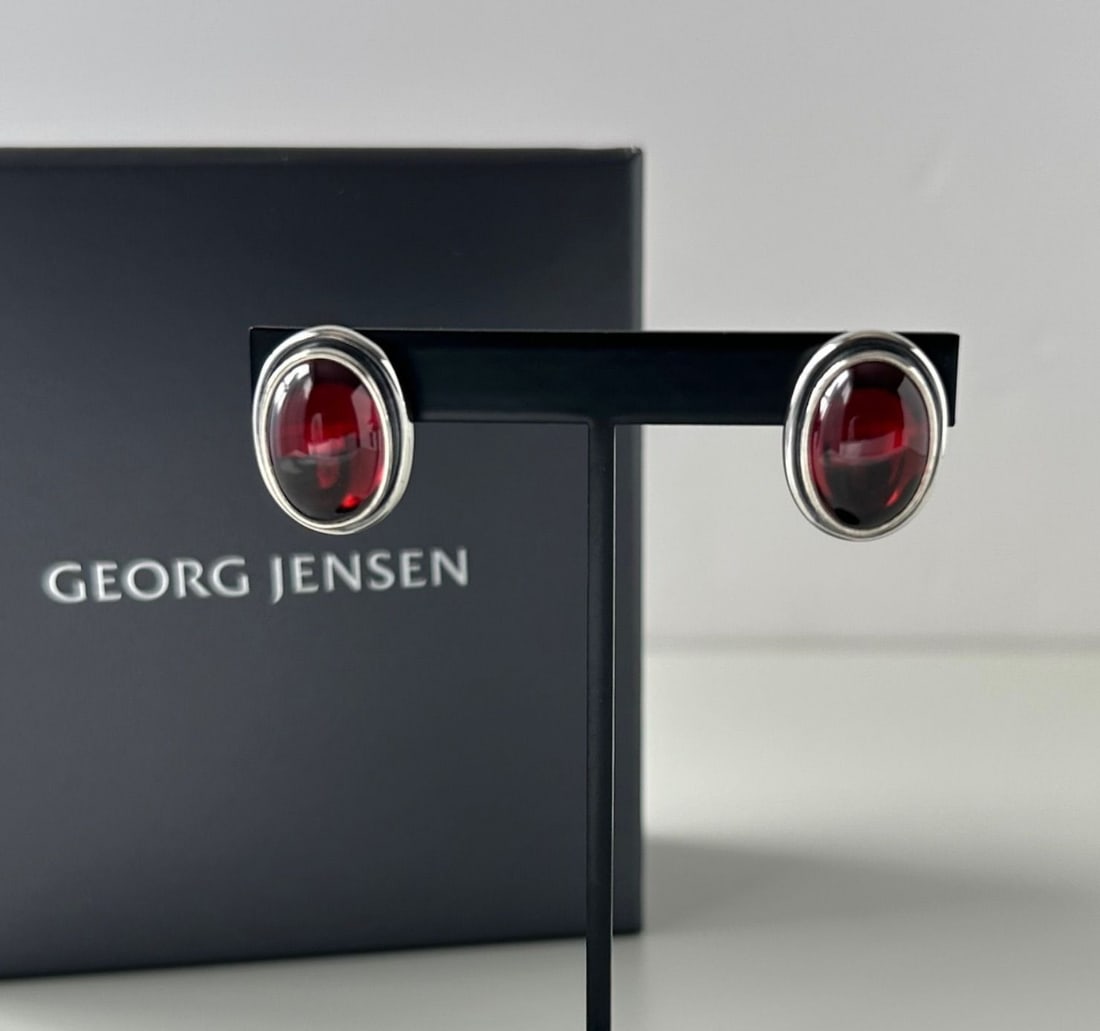 Georg Jensen No. 86B Moonlight Blossom Garnet Silver Earrings in Original Box: Georg Jensen No. 86B Moonlight Blossom Garnet Silver Earrings in Original Box Elevate your elegance with these stunning Georg Jensen No. 86B Moonlight Blossom garnet silver earrings, featuring two vib