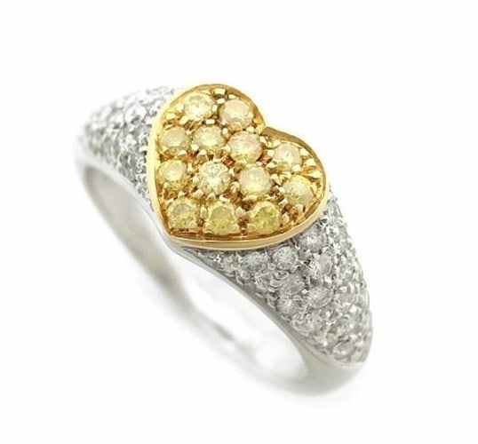 Picchiotti 0.70ct 18k Yellow & White Gold Two Tone Heart Ring: Picchiotti 0.70ct 18k Yellow & White Gold Two Tone Heart Ring A stunning 18k yellow and white gold two-tone heart ring, adorned with a beautiful round diamond weighing 0.70ct, is sure to make a statem