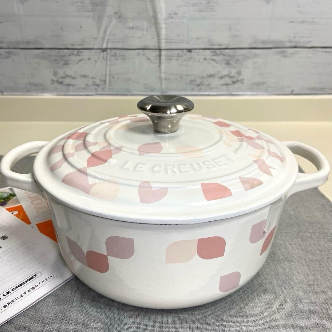 Le Creuset 20cm Enamel Cast Iron Round Petal Cocotte: Le Creuset 20cm Enamel Cast Iron Round Petal Cocotte Elevate your cooking with the Le Creuset 20cm Enamel Cast Iron Round Petal Cocotte, a stunning addition to any kitchen. This beautifully crafted co