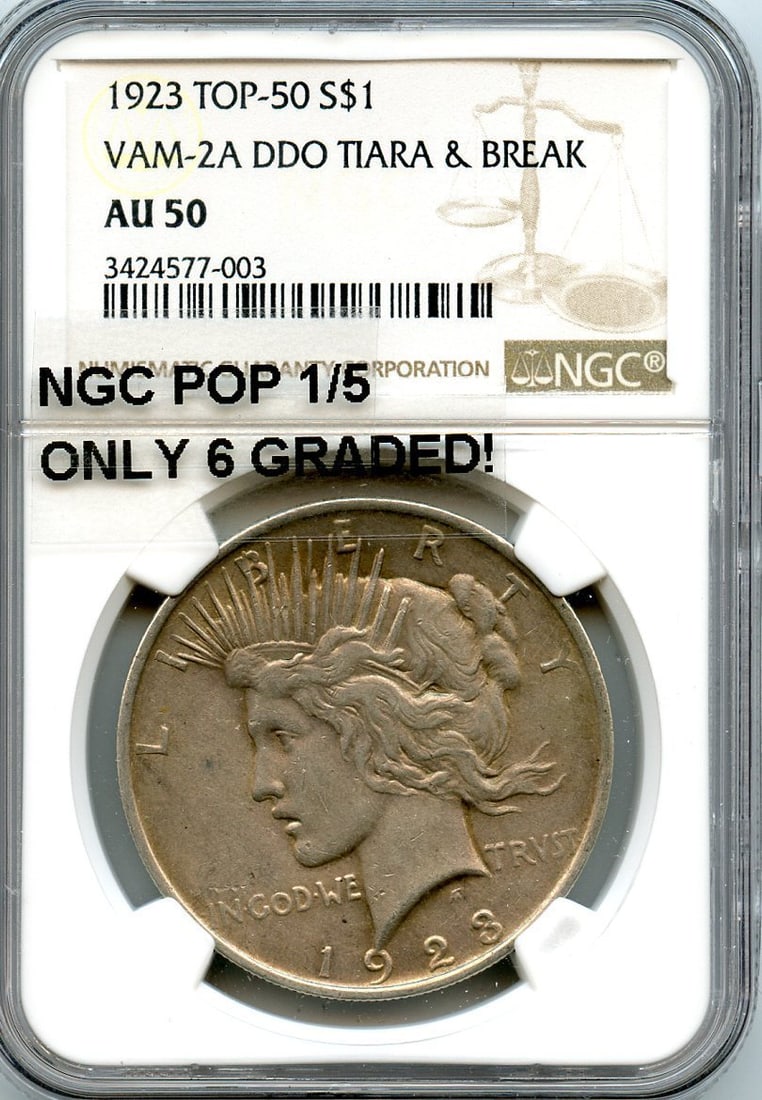 1923 VAM-2A DDO Tiara & Break Top 50 Peace Dollar NGC AU50, Pop 1/ 5: 1923 VAM-2A DDO Tiara & Break Top 50 Peace Dollar NGC AU50, Pop 1/ 5 Experience the rare beauty of the 1923 VAM-2A DDO Tiara & Break Top 50 Peace Dollar, graded AU50 by NGC and certified as Pop 1/5. T