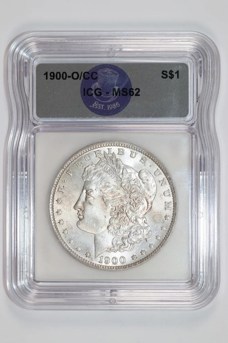 1900-O Morgan Dollar ICG MS62: 1900-O Morgan Dollar ICG MS62 Experience the beauty of the 1900-O Morgan Dollar, certified by the International Coin Grading Service (ICG) as MS62. This stunning example boasts its original silver con