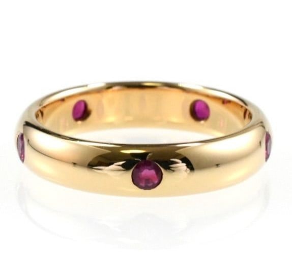 c1992 Vintage Cartier Stella 5P Ruby 18k Yellow Gold Band Ring Size 49 US 4.75: c1992 Vintage Cartier Stella 5P Ruby 18k Yellow Gold Band Ring Size 49 US 4.75 Experience the timeless elegance of Cartier's 1992 Stella collection with this stunning ruby ring in 18k yellow gold. The