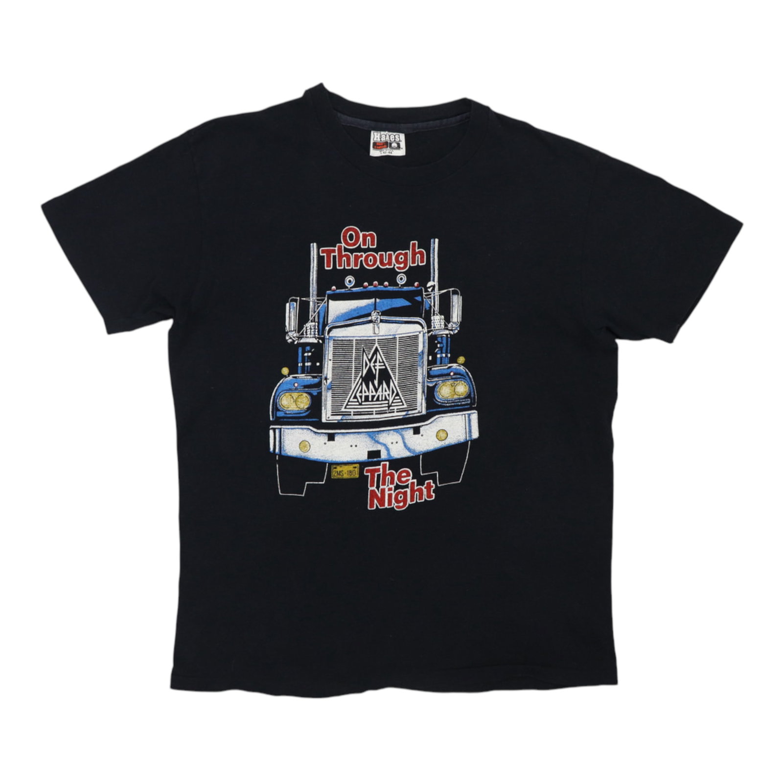 Shirt 1980 Def Leppard On Through The Night: Shirt 1980 Def Leppard On Through The Night Get ready to rock with the iconic 1980 Def Leppard On Through The Night tour shirt, made from 100% cotton and featuring a classic black design. Measuring in