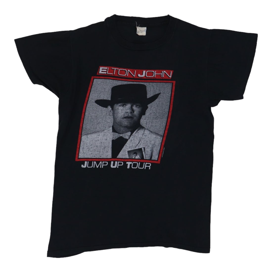 Elton John 1982 Jump Up Tour Shirt: Elton John 1982 Jump Up Tour Shirt Get ready to rock with this authentic 1982 Elton John Jump Up Tour shirt, featuring bold front and back graphics that scream the iconic era of music history. Made fr