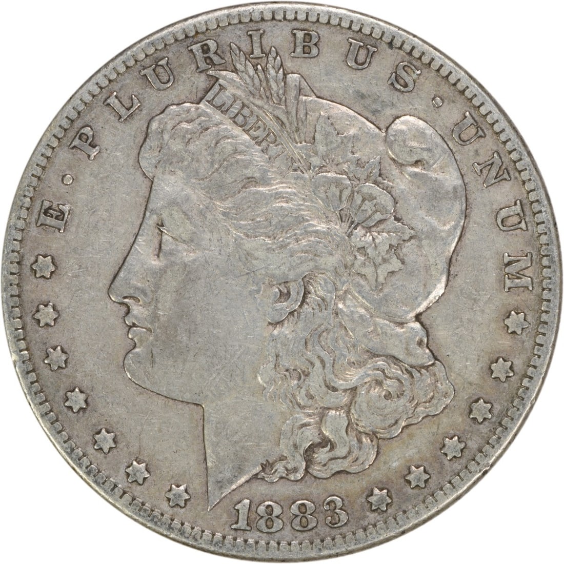 1883-S Morgan Dollar - Choice VF Uncertified: 1883-S Morgan Dollar - Choice VF Uncertified Experience the iconic 1883-S Morgan Dollar, a rare and highly sought-after coin from the United States Mint in San Francisco. With its striking reeded edge