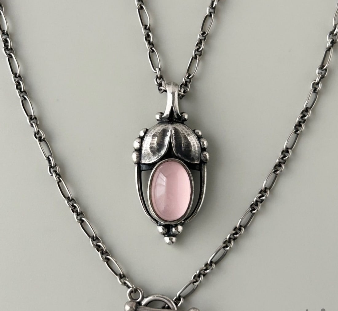 Georg Jensen Sterling Silver Rose Quartz Pendant Necklace 17.5 inches: Georg Jensen Sterling Silver Rose Quartz Pendant Necklace 17.5 inches Elevate your special occasions with the exquisite Georg Jensen Sterling Silver Rose Quartz Pendant Necklace, crafted from 925 ster