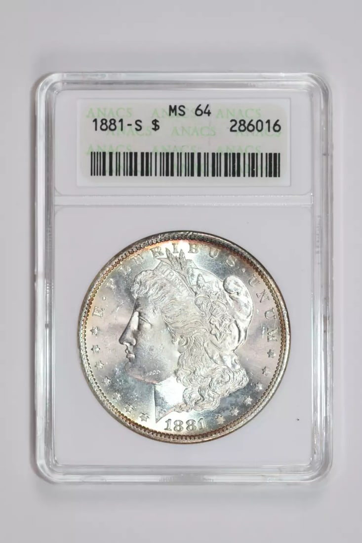 SOAPBOX 1881-S MORGAN DOLLAR ANACS MS64 LOOKS PL AND NICER: SOAPBOX 1881-S MORGAN DOLLAR ANACS MS64 LOOKS PL AND NICER A stunning example of American numismatics, this 1881-S Morgan Dollar is certified MS64 by the renowned ANACS grading service, showcasing exc