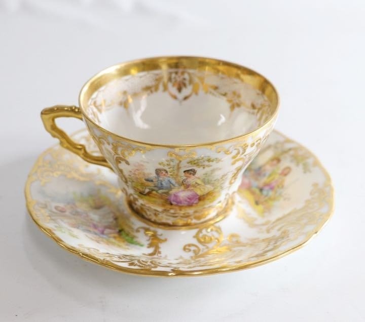 German Vintage Dresden Cup Saucer in Antique Porcelain with Gold Trim: German Vintage Dresden Cup Saucer in Antique Porcelain with Gold Trim This stunning German Vintage Dresden Cup Saucer is a true antique treasure, boasting intricate gold trim and delicate porcelain cr